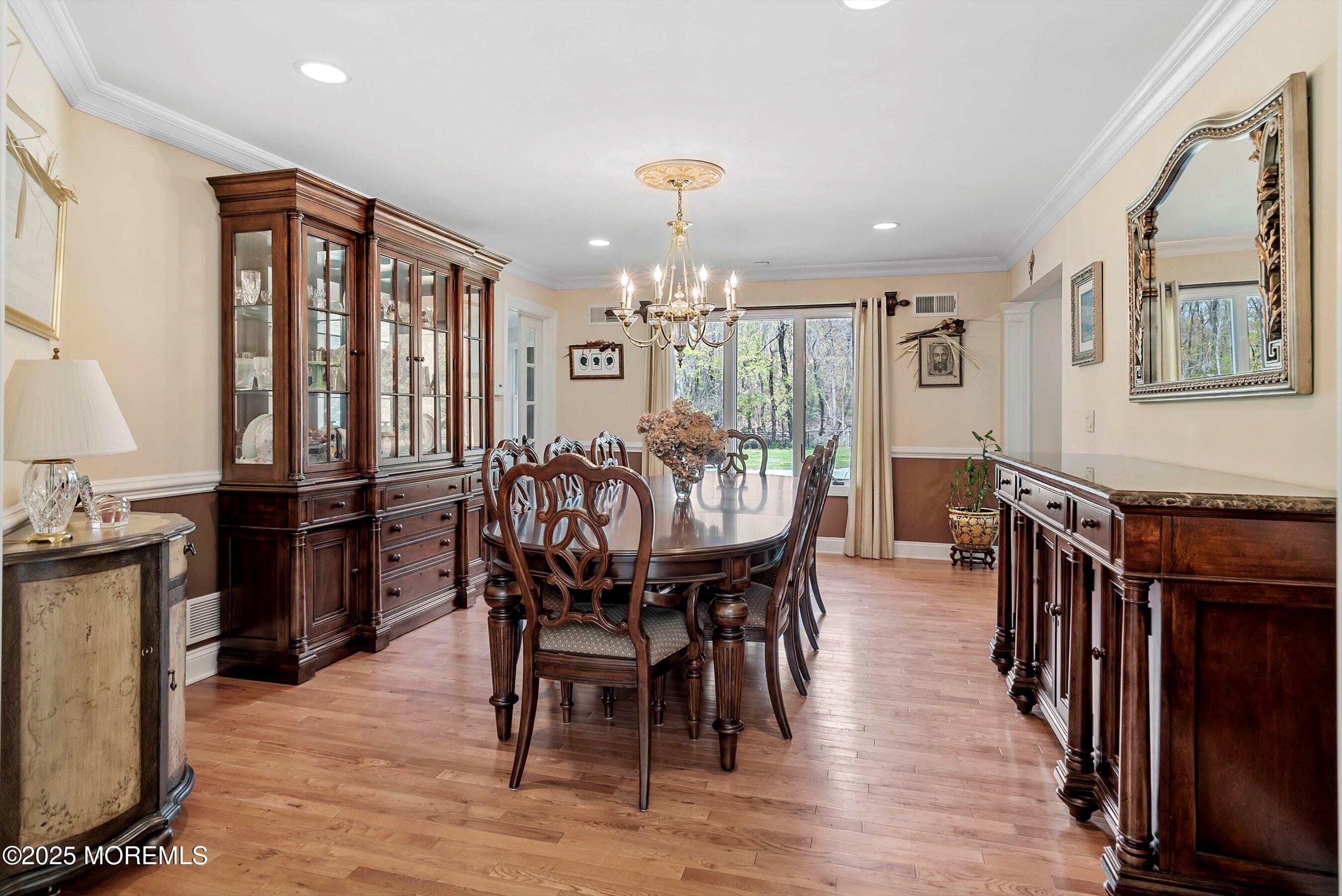 39 Primrose Lane Colts Neck, NJ 07722 - Photo 33 of 52 a view of a dining room with furniture window and wooden floor