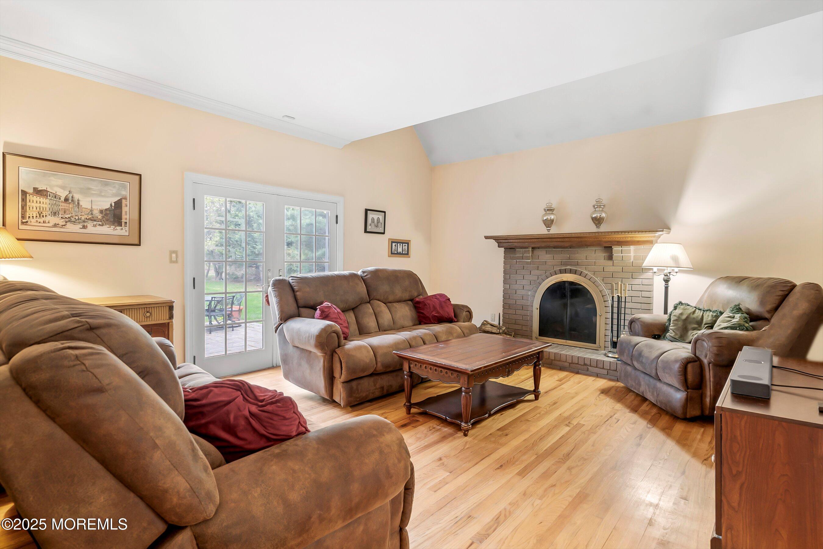 39 Primrose Lane Colts Neck, NJ 07722 - Photo 38 of 52 a living room with furniture a couch and a fireplace