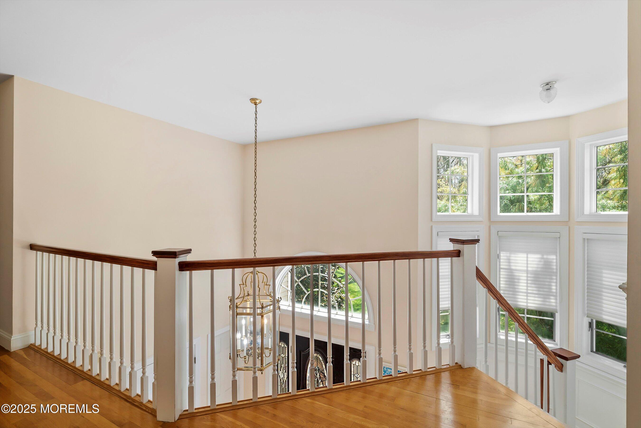 39 Primrose Lane Colts Neck, NJ 07722 - Photo 42 of 52 a view of a hallway with windows