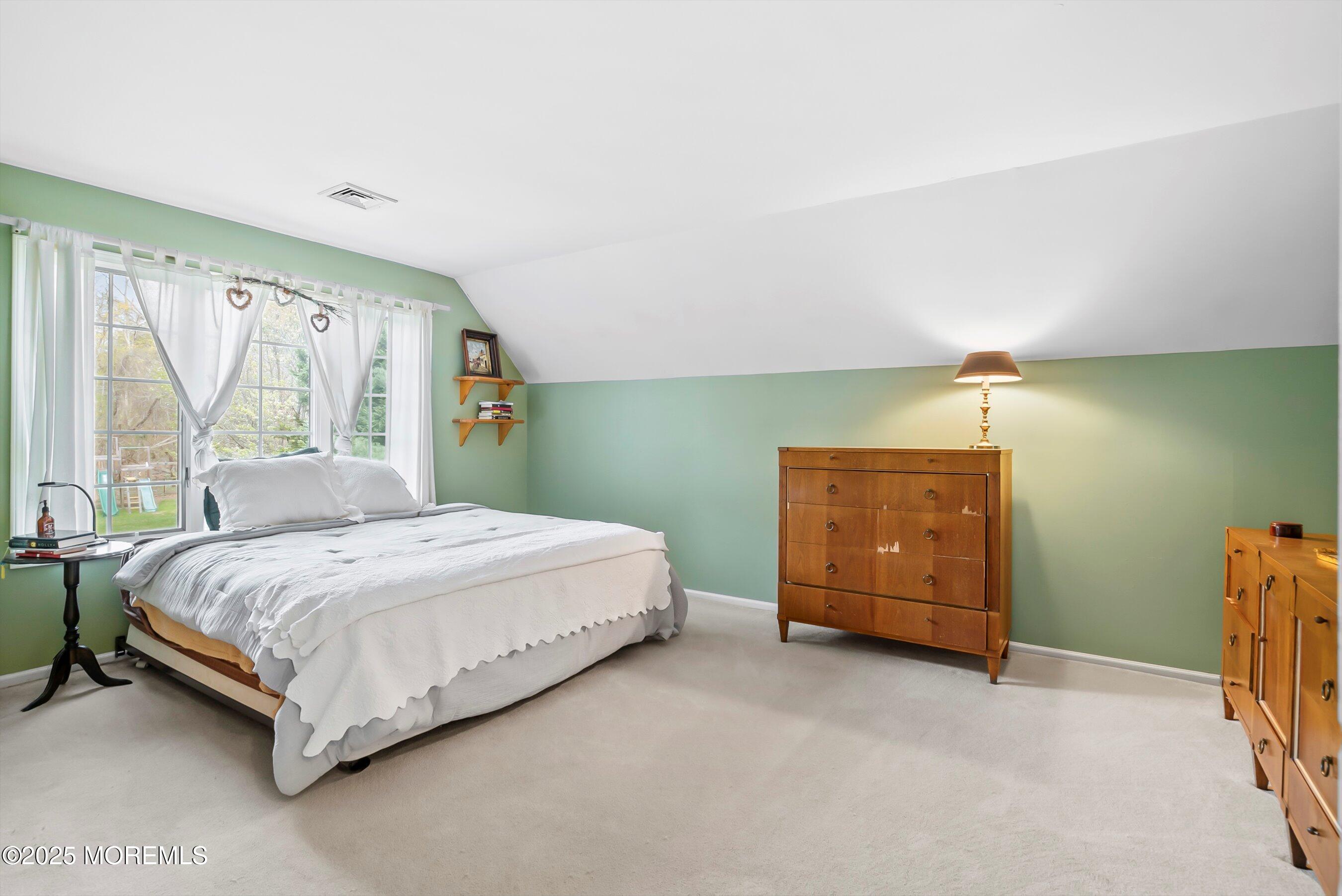 39 Primrose Lane Colts Neck, NJ 07722 - Photo 43 of 52 a bedroom with a bed and a dresser