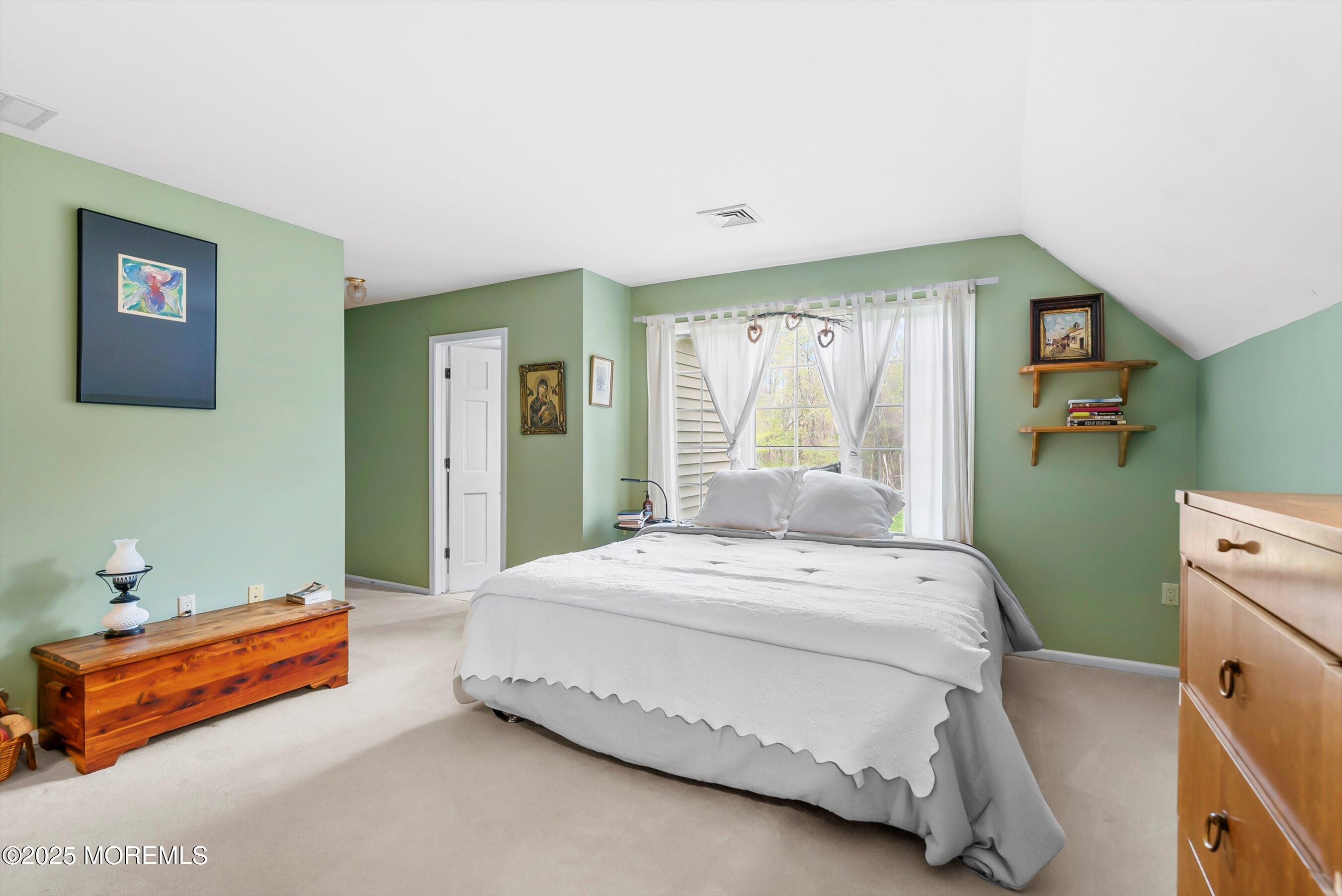 39 Primrose Lane Colts Neck, NJ 07722 - Photo 44 of 52 a spacious bedroom with a bed and a window
