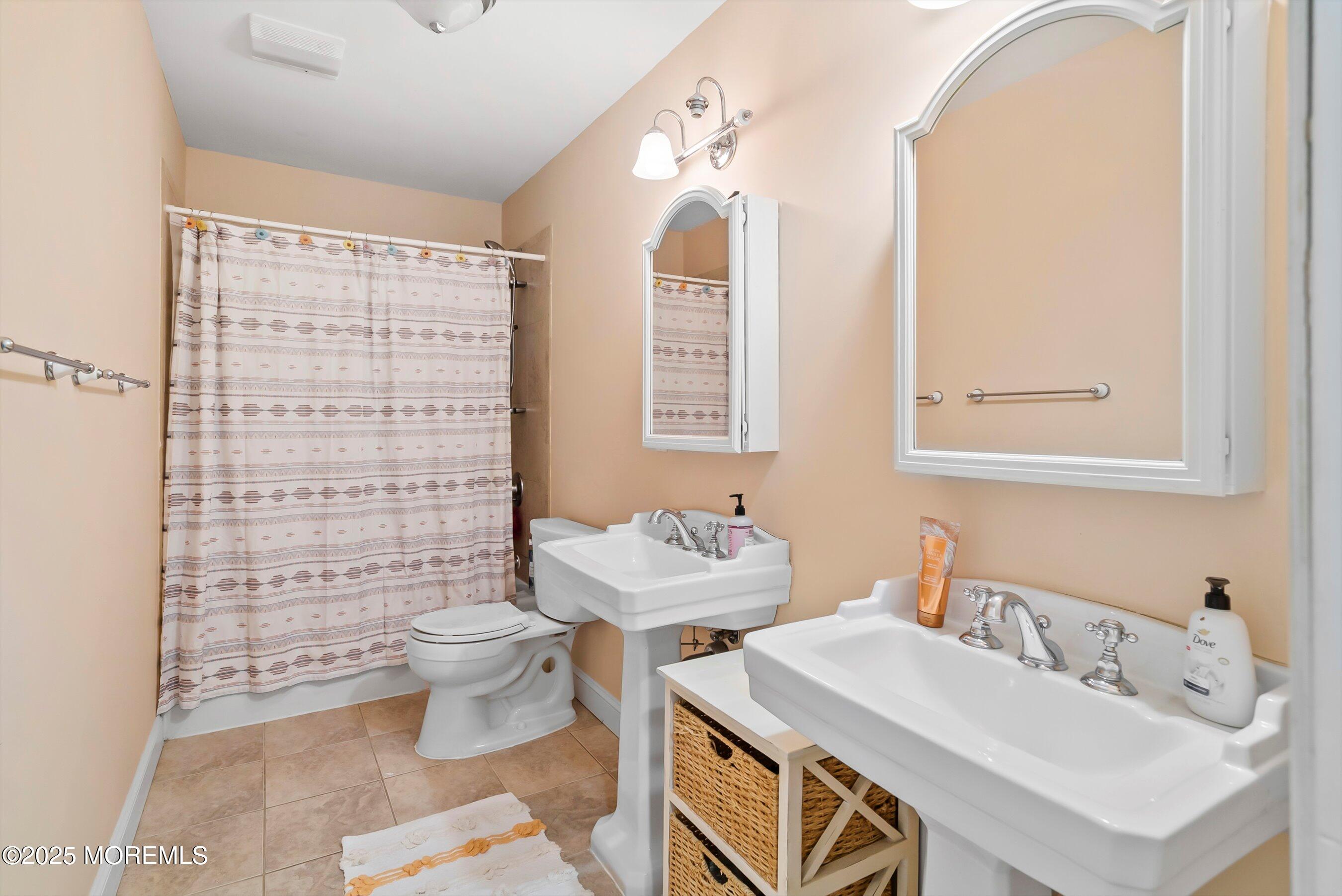 39 Primrose Lane Colts Neck, NJ 07722 - Photo 7 of 52 a bathroom with a sink toilet and shower