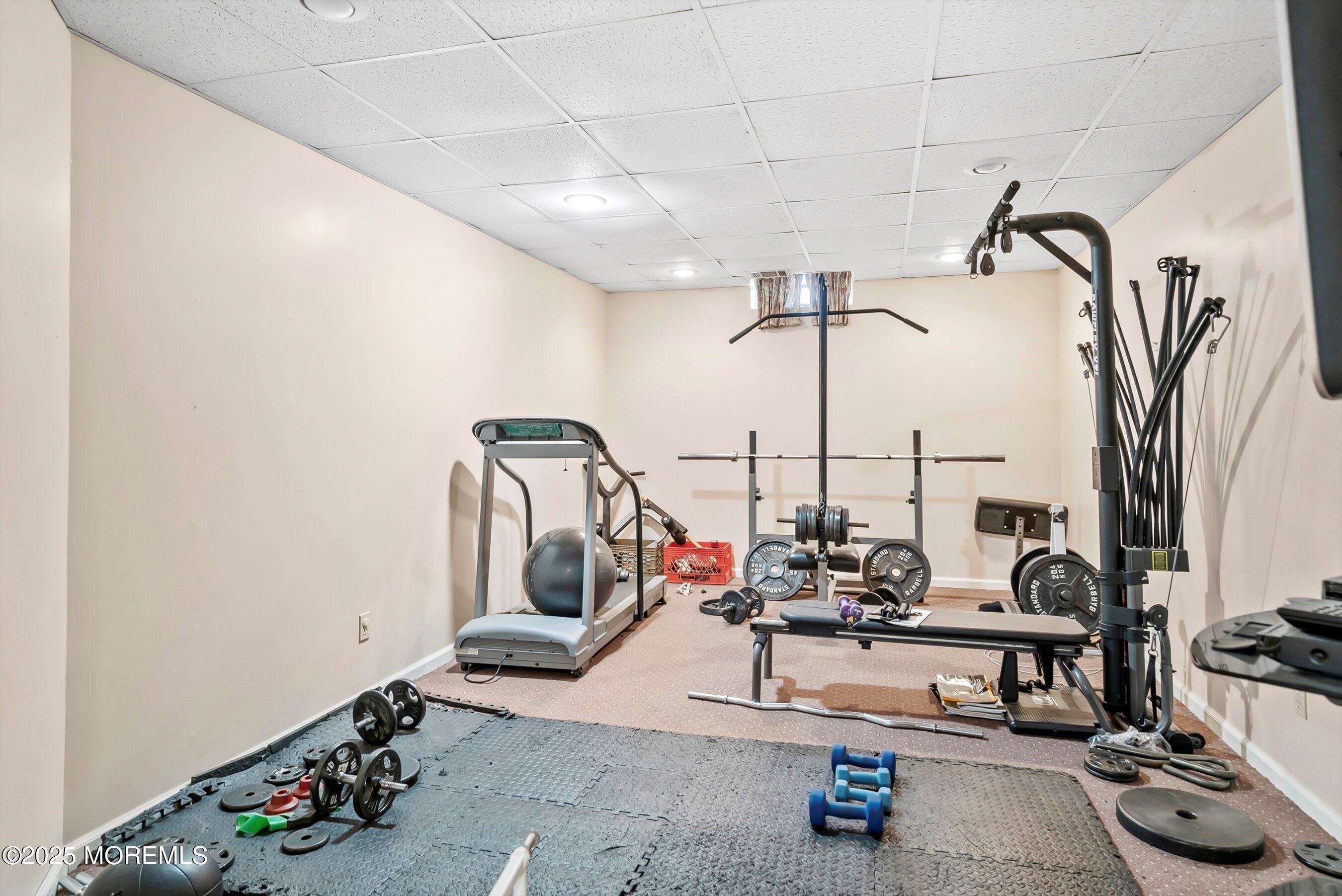 39 Primrose Lane Colts Neck, NJ 07722 - Photo 10 of 52 a view of a room with gym equipment