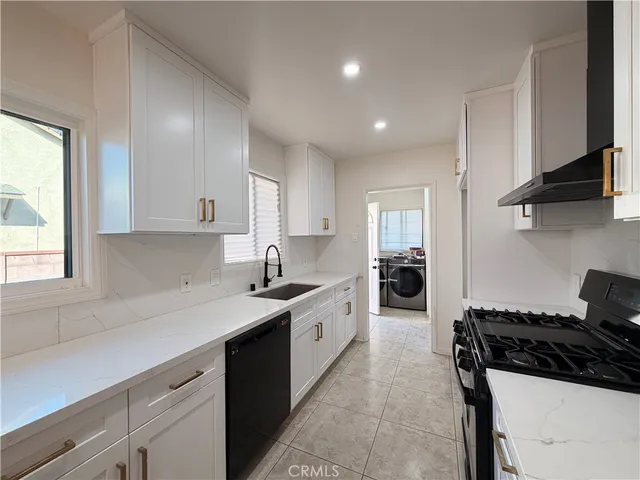 a stove top oven sitting inside of a kitchen