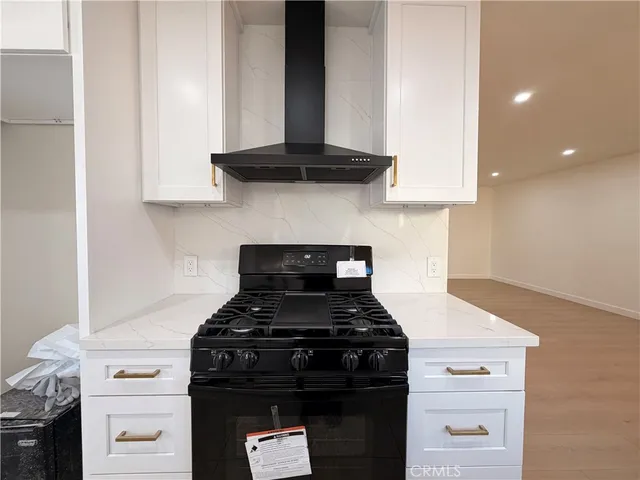 a kitchen with a sink cabinets and window