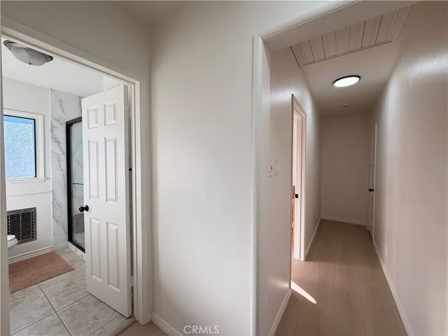 a view of room with window and a ceiling fan