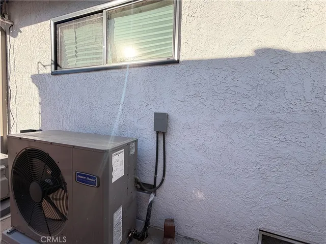 a hallway with a small white building