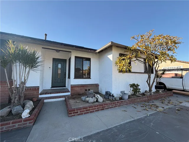 a front view of a house with sitting area