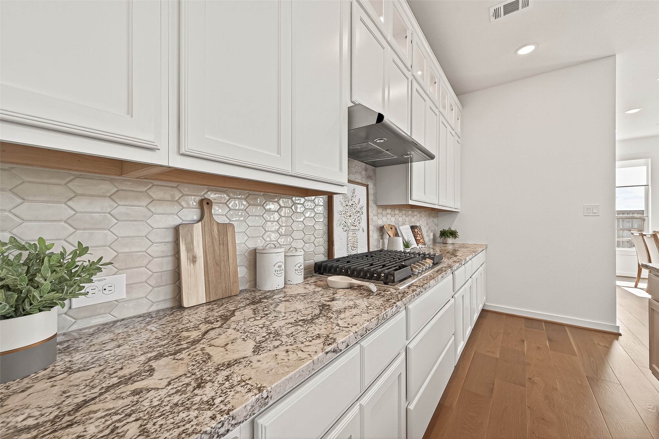 7427 Compass Drive Katy, TX 77493 - Photo 15 of 49 a kitchen with stainless steel appliances granite countertop a sink stove and cabinets