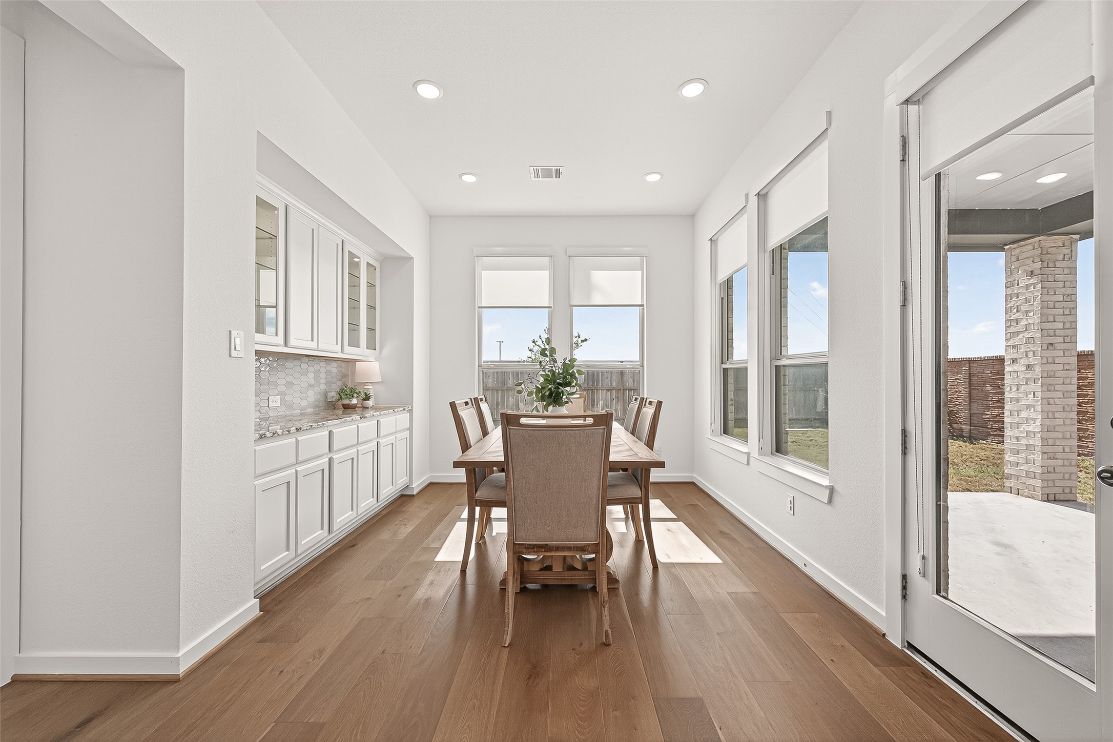 7427 Compass Drive Katy, TX 77493 - Photo 17 of 49 a dining room with furniture window and wooden floor