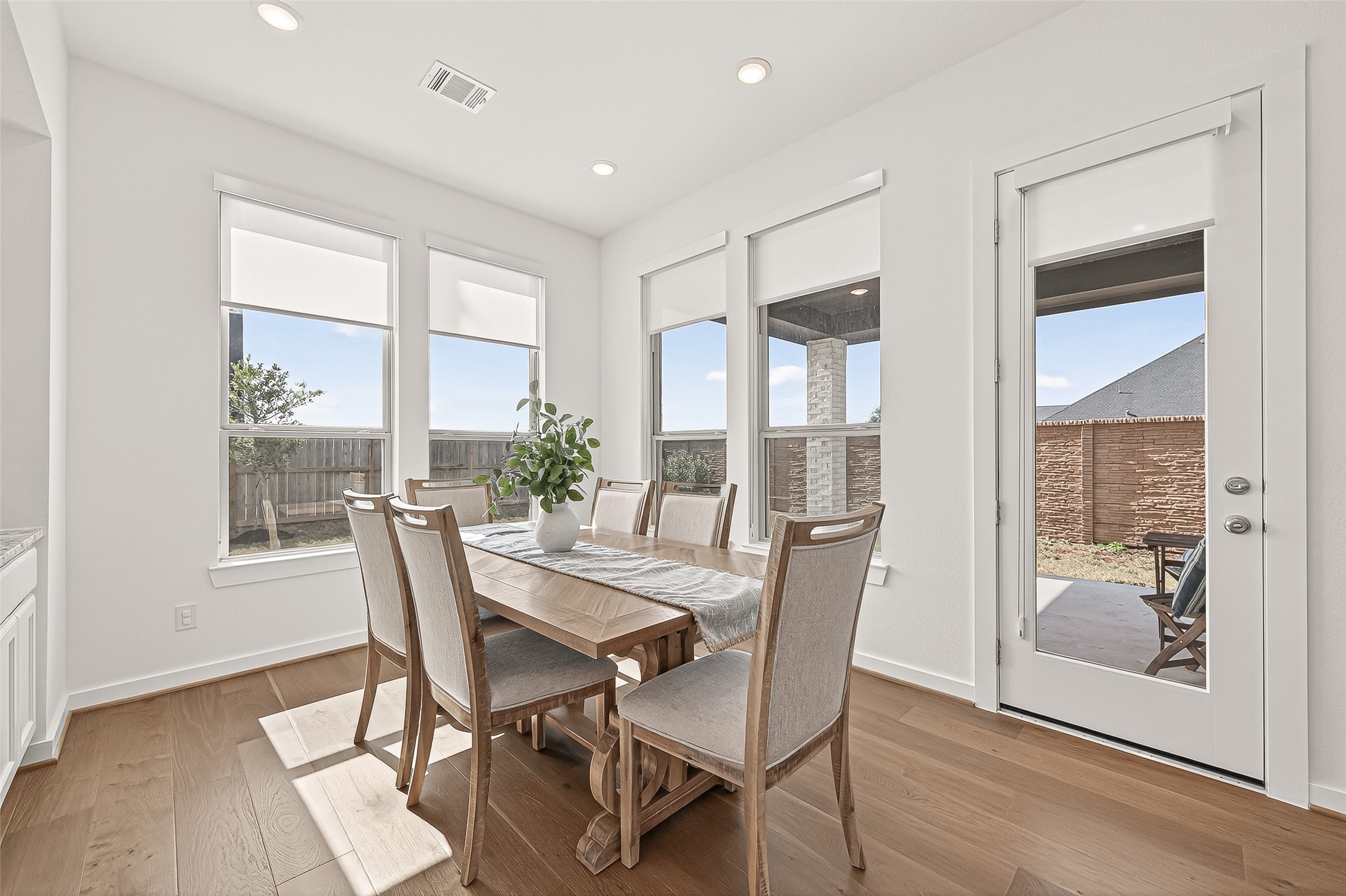 7427 Compass Drive Katy, TX 77493 - Photo 19 of 49 a view of a dining room with furniture window and wooden floor