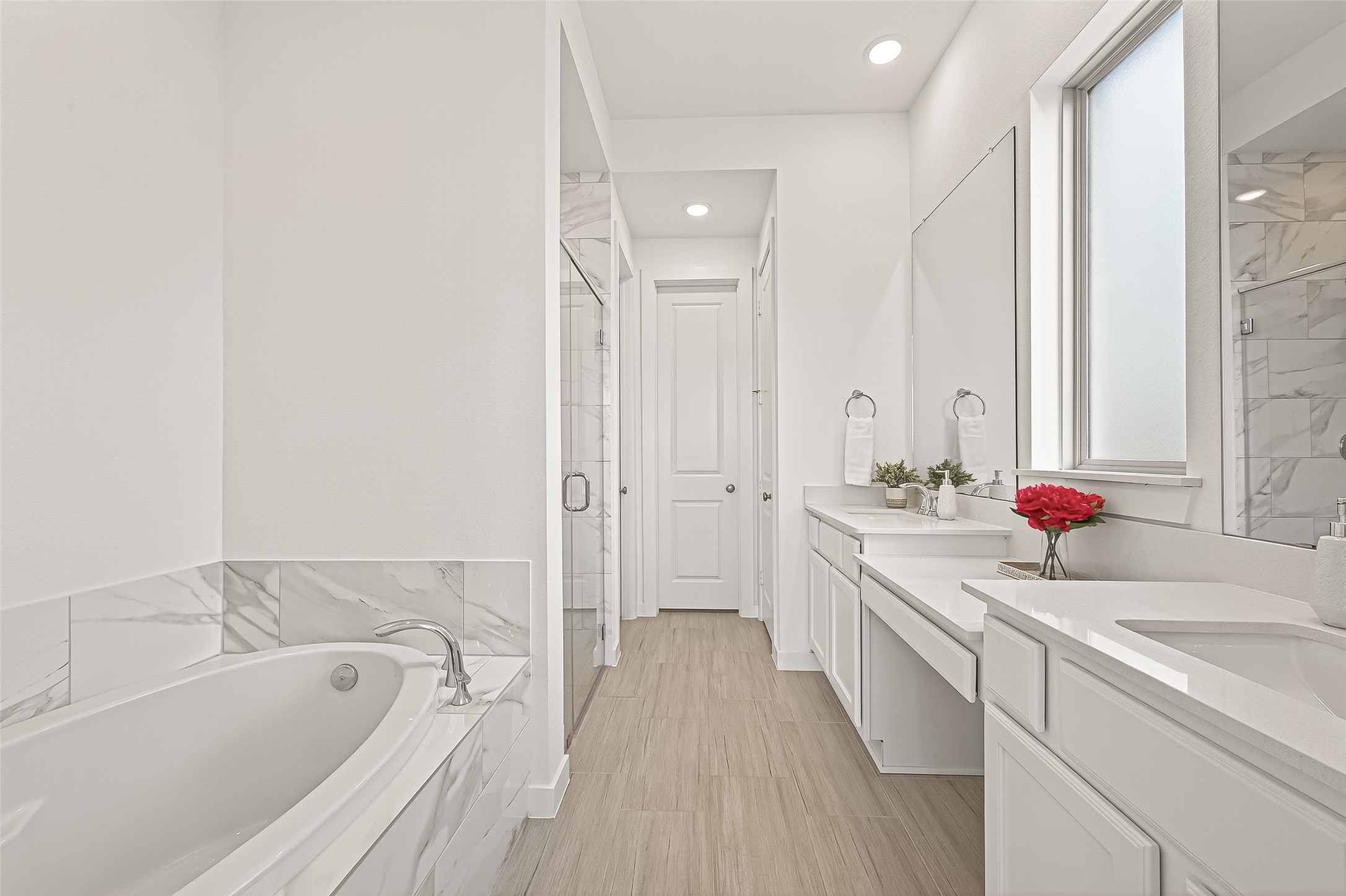7427 Compass Drive Katy, TX 77493 - Photo 23 of 49 a bathroom with a granite countertop double vanity sink a mirror and a bathtub