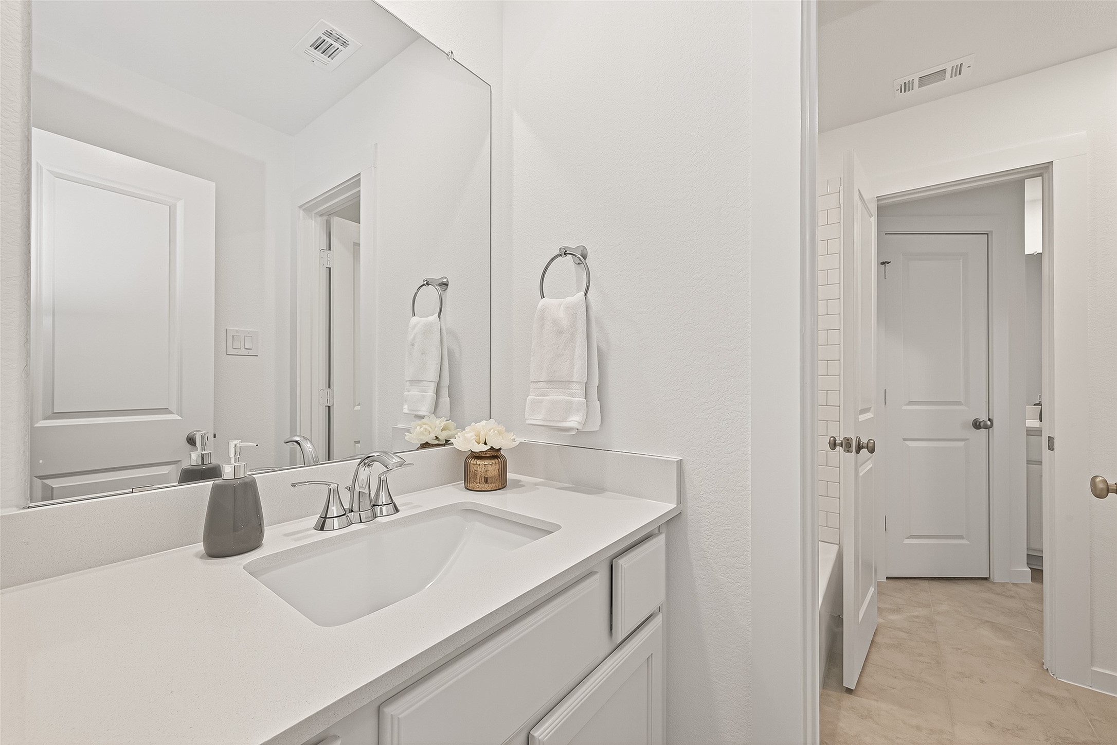 7427 Compass Drive Katy, TX 77493 - Photo 38 of 49 a bathroom with a sink and a mirror