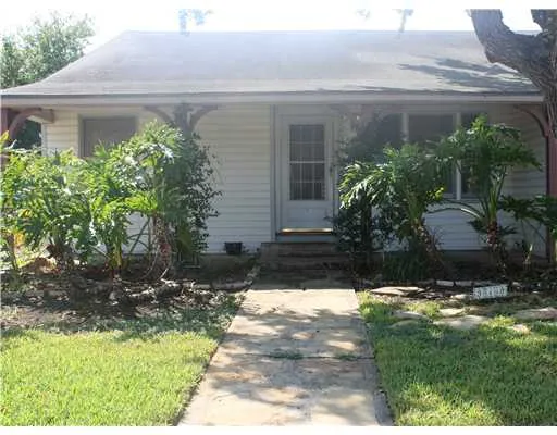 a view of a back yard of the house