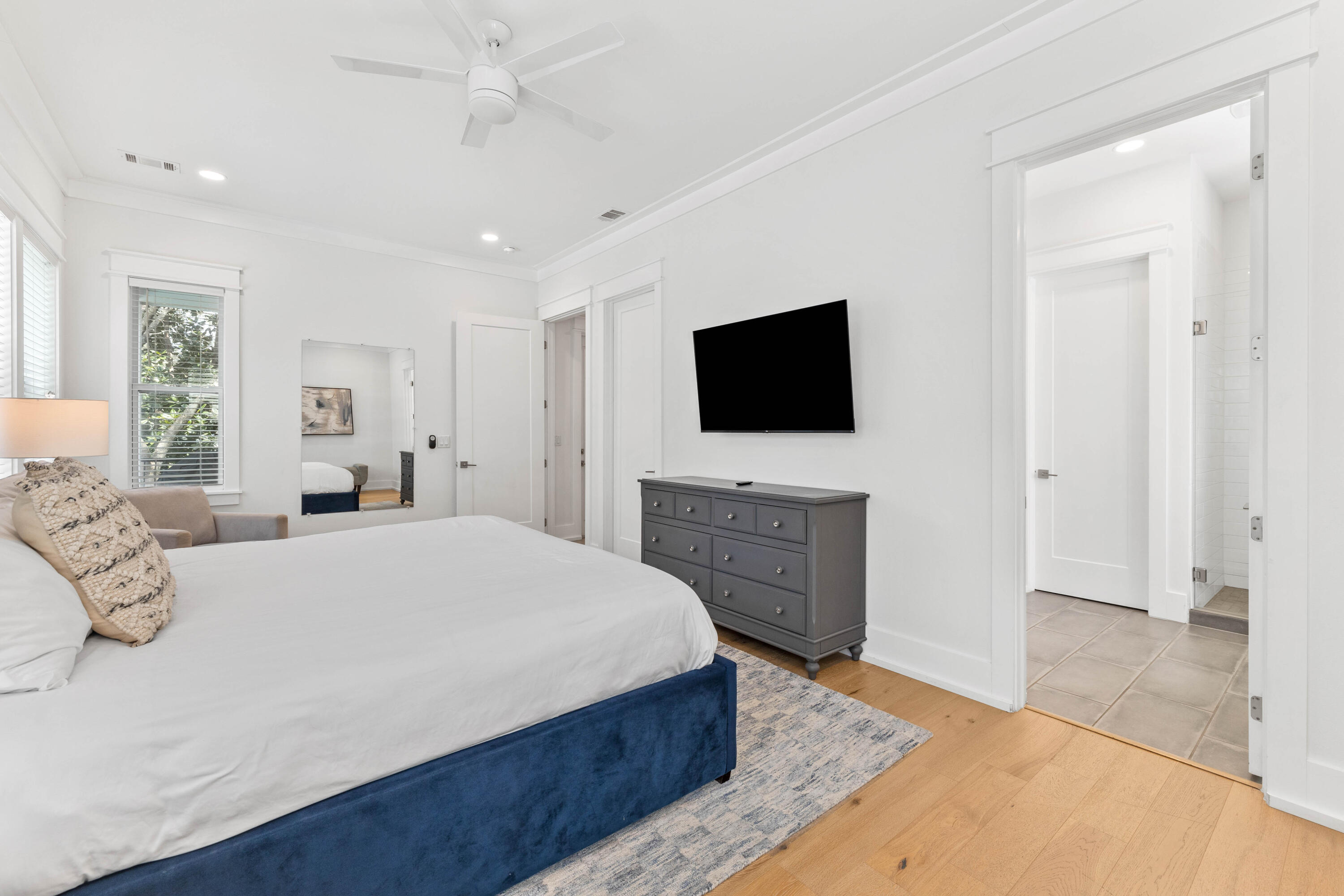 4635 Sunset Pointe Destin, FL 32541 - Photo 12 of 48 a spacious bedroom with a bed and a flat screen tv