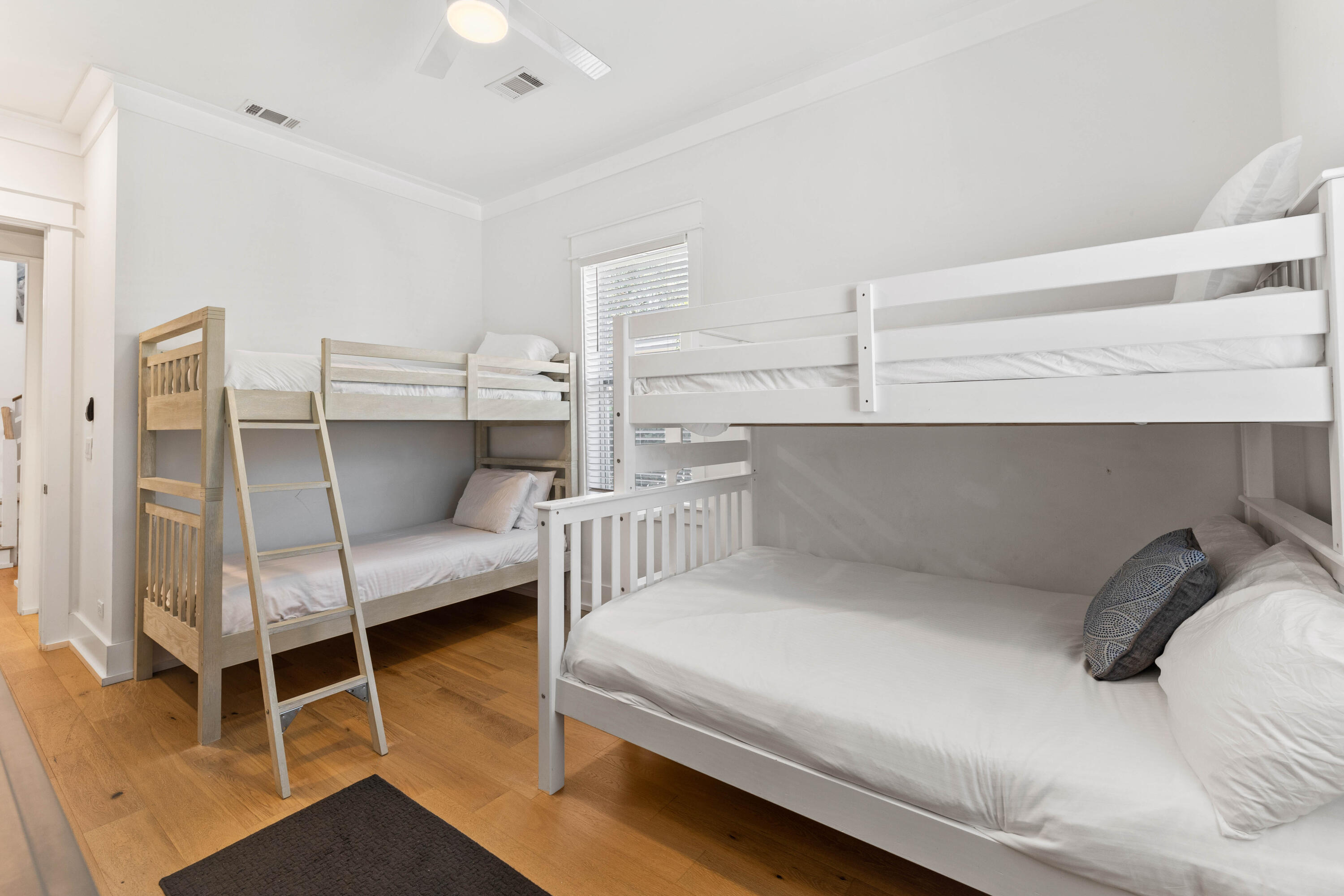 4635 Sunset Pointe Destin, FL 32541 - Photo 16 of 48 a bedroom with a bed and a cabinets