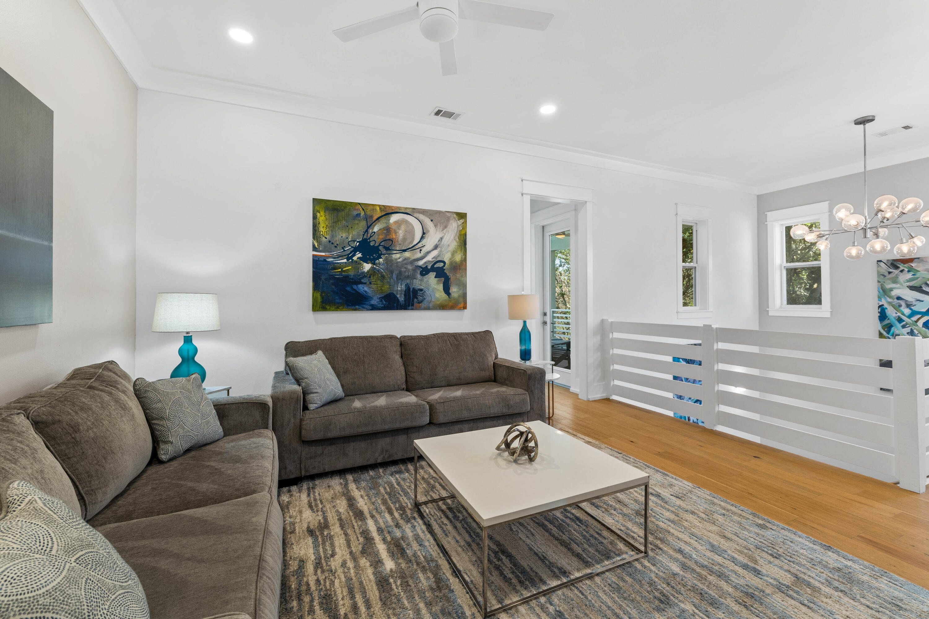 4635 Sunset Pointe Destin, FL 32541 - Photo 20 of 48 a living room with furniture and a wooden floor