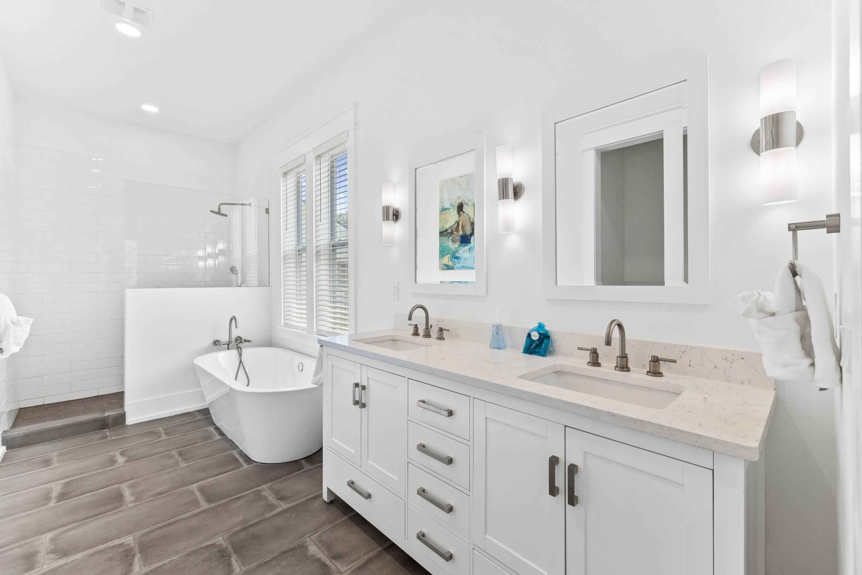 4635 Sunset Pointe Destin, FL 32541 - Photo 23 of 48 a spacious bathroom with a double vanity sink mirror and bathtub