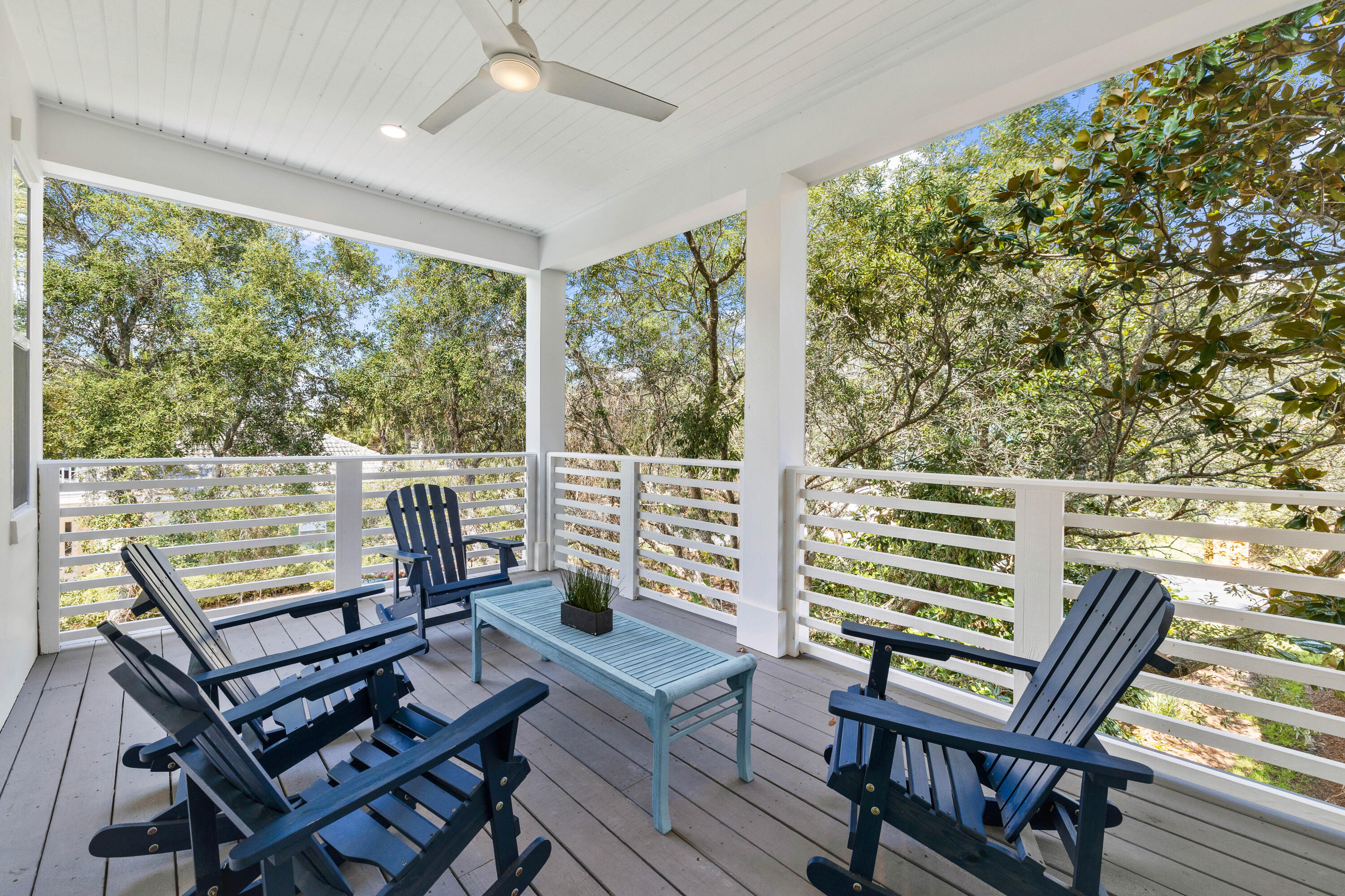 4635 Sunset Pointe Destin, FL 32541 - Photo 24 of 48 a view of a balcony with furniture and wooden floor