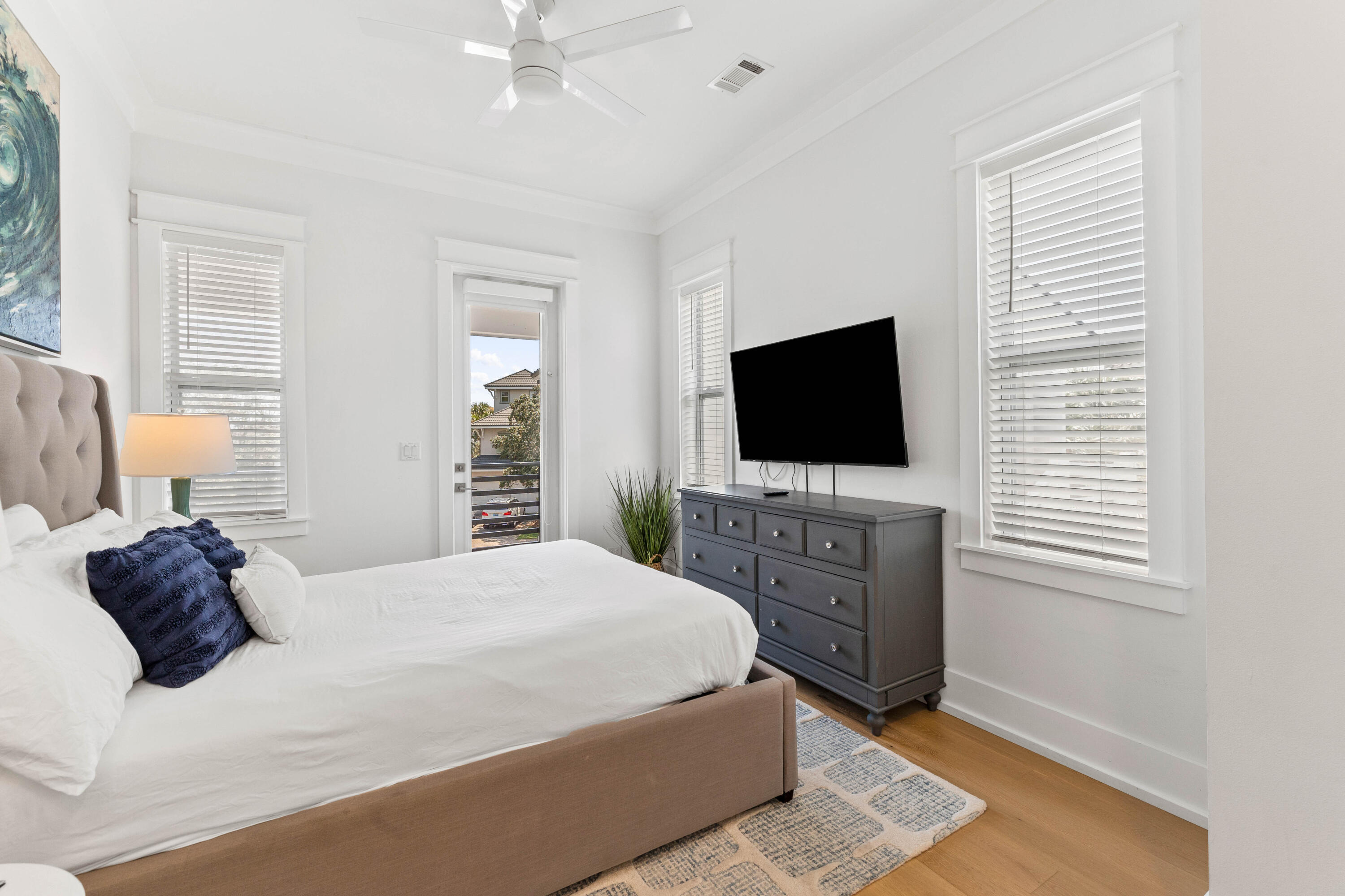 4635 Sunset Pointe Destin, FL 32541 - Photo 25 of 48 a bedroom with a bed and a flat screen tv