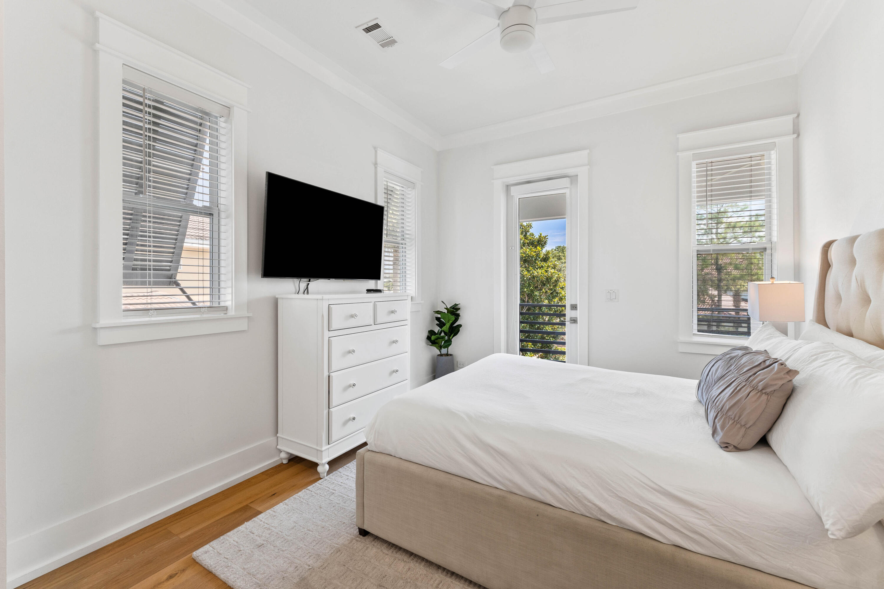 4635 Sunset Pointe Destin, FL 32541 - Photo 29 of 48 a bedroom with a bed and a flat screen tv