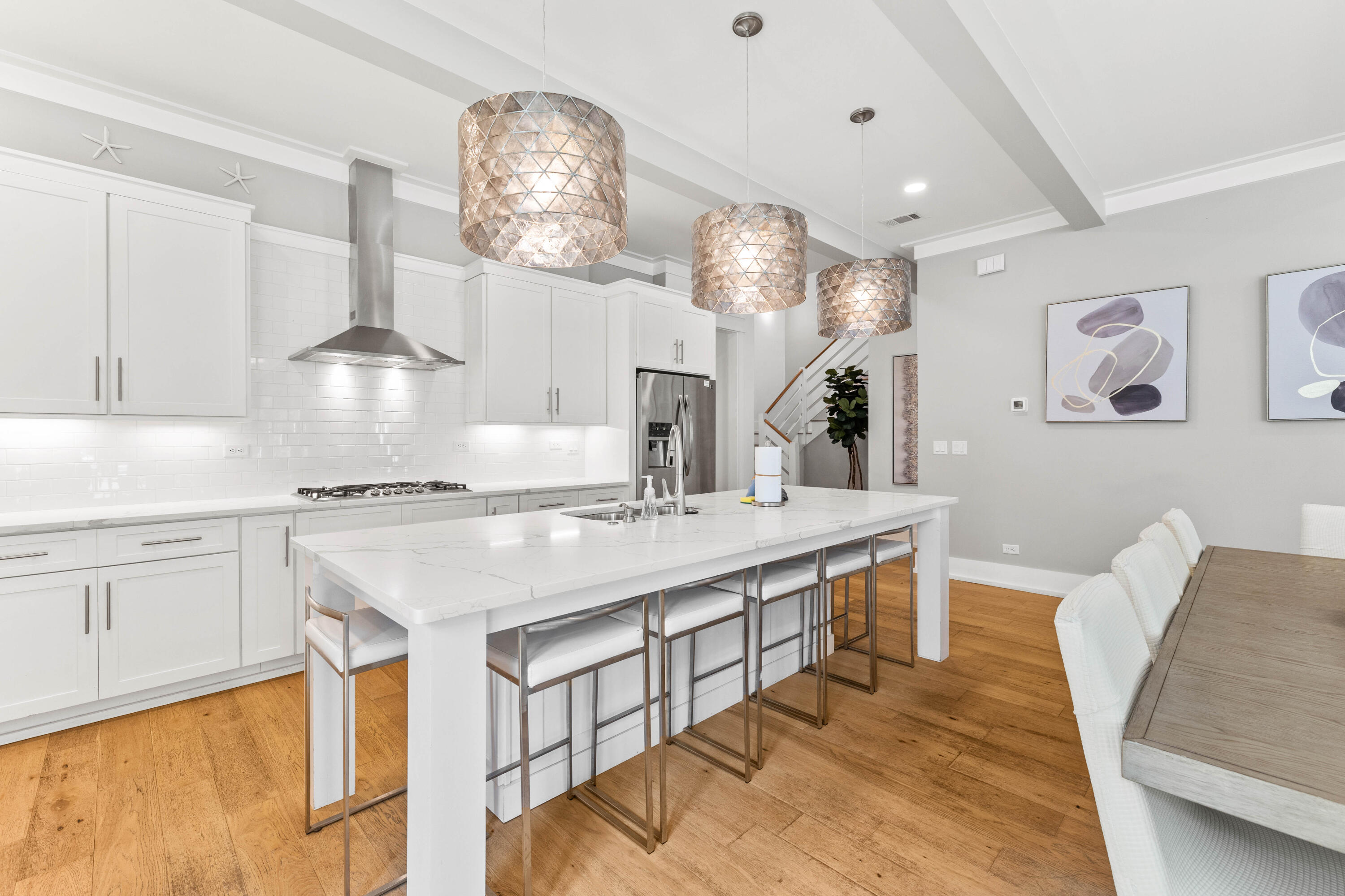 4635 Sunset Pointe Destin, FL 32541 - Photo 6 of 48 a kitchen with cabinets a sink outdoor seating and view living room