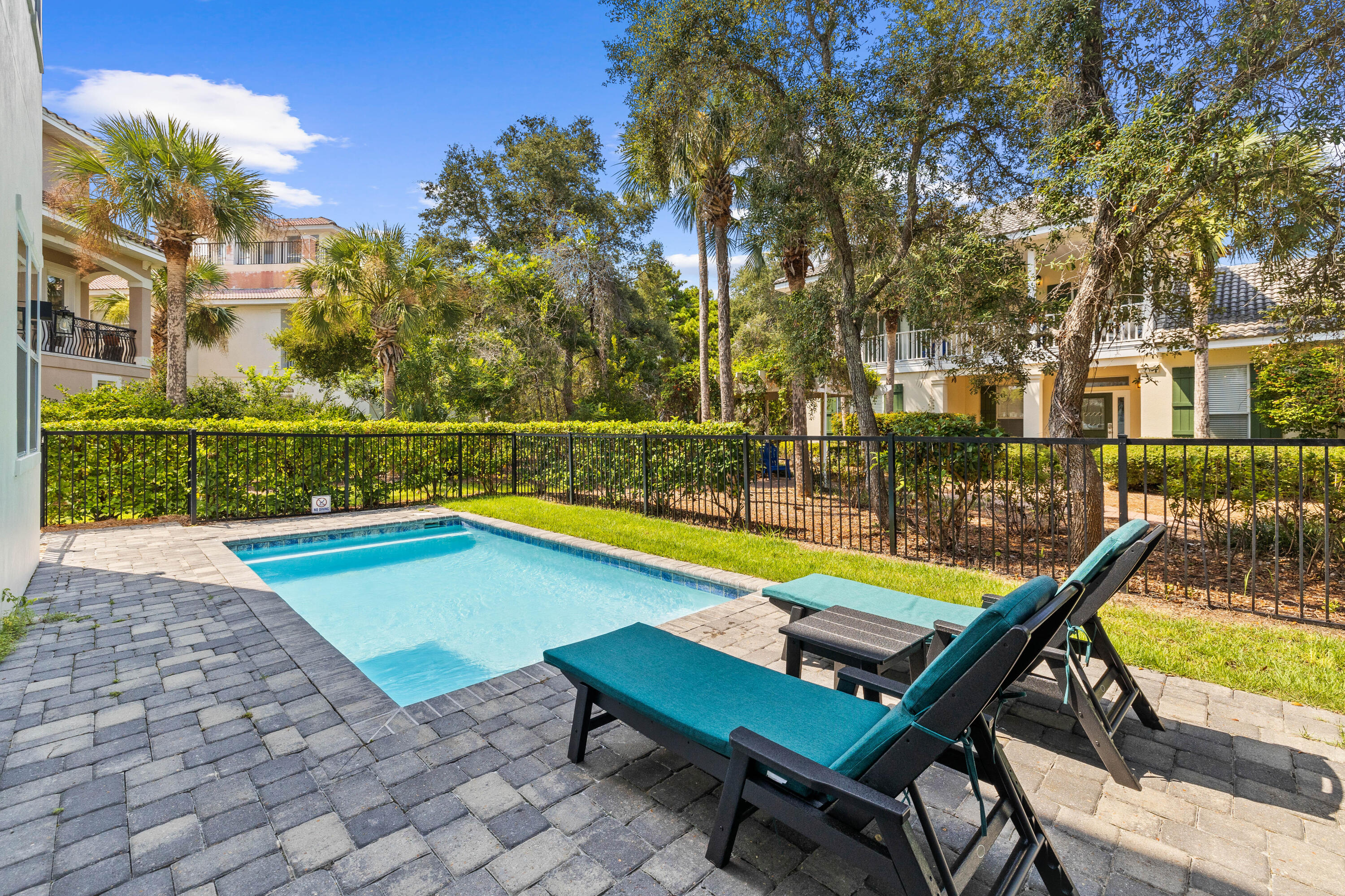 4635 Sunset Pointe Destin, FL 32541 - Photo 8 of 48 a swimming pool with outdoor seating and yard