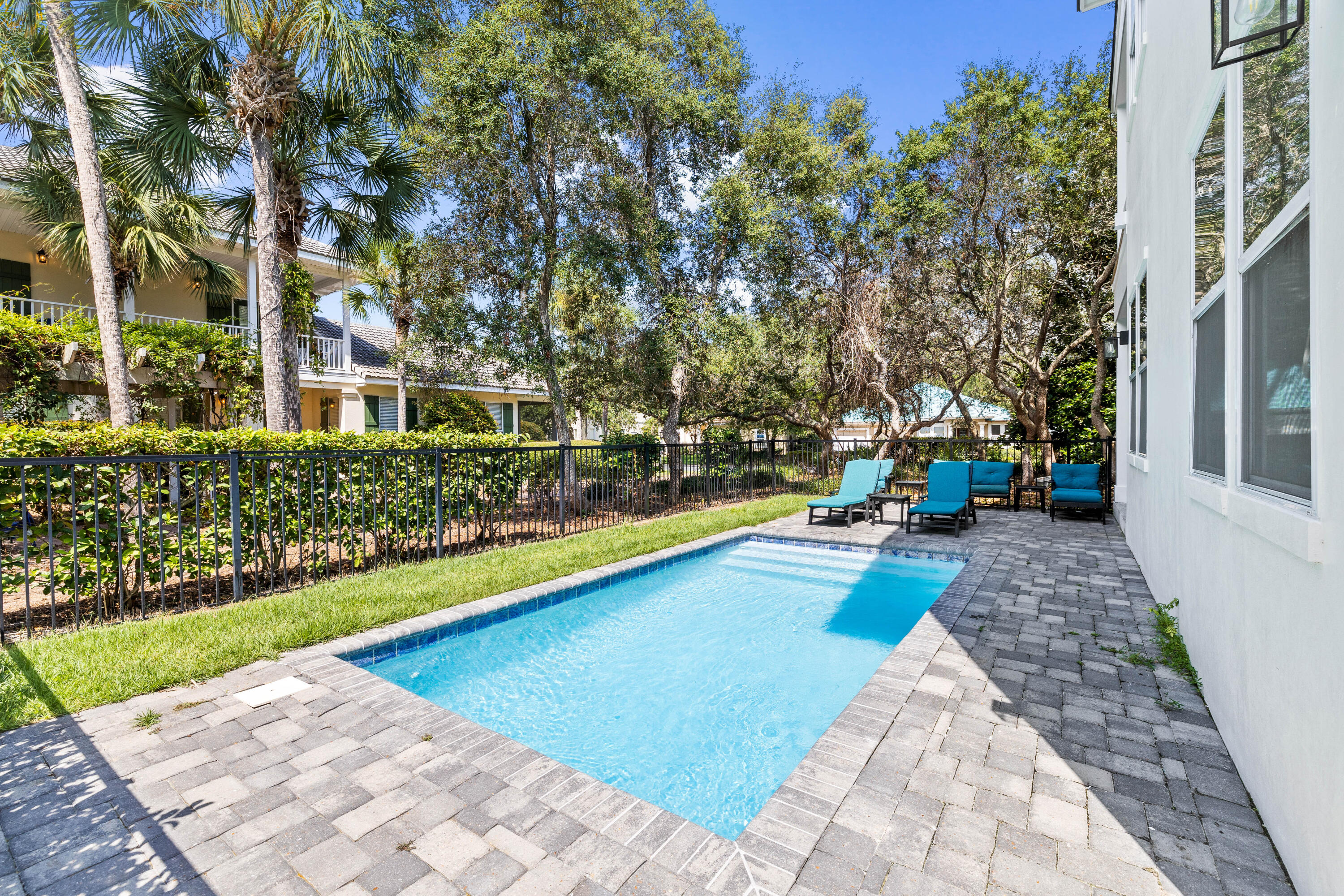 4635 Sunset Pointe Destin, FL 32541 - Photo 9 of 48 a view of yard with swimming pool and sitting area