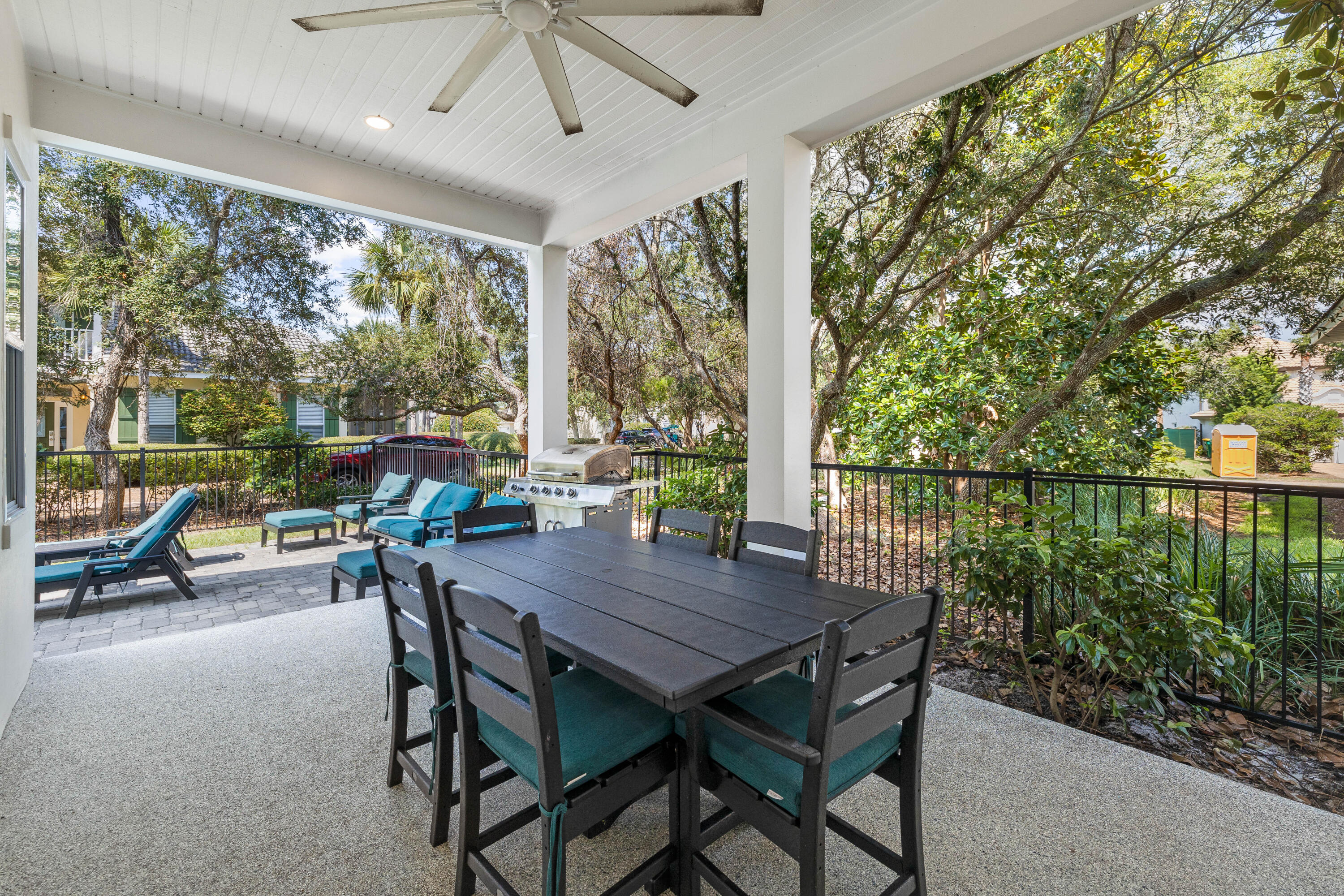 4635 Sunset Pointe Destin, FL 32541 - Photo 10 of 48 a view of a patio with a table chairs and backyard
