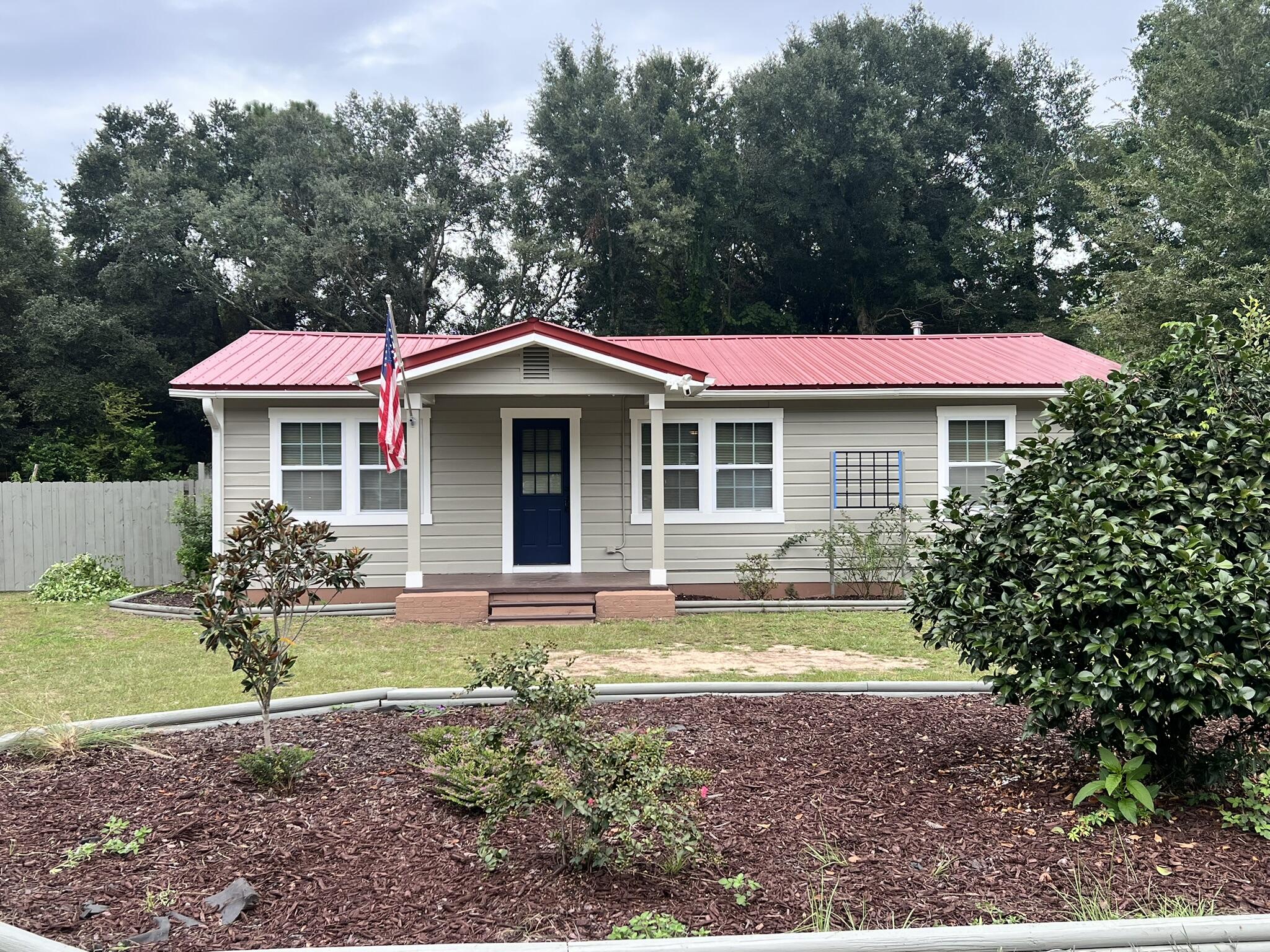 2361 Susan Drive Crestview, FL 32536 - Photo 12 of 12 a view of a house with a yard and sitting area