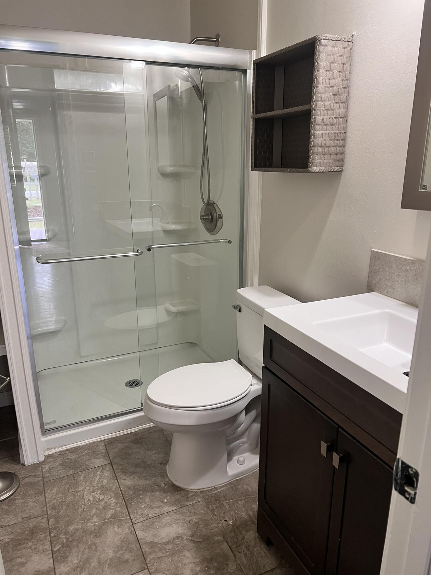 2361 Susan Drive Crestview, FL 32536 - Photo 7 of 12 a bathroom with a sink toilet and shower