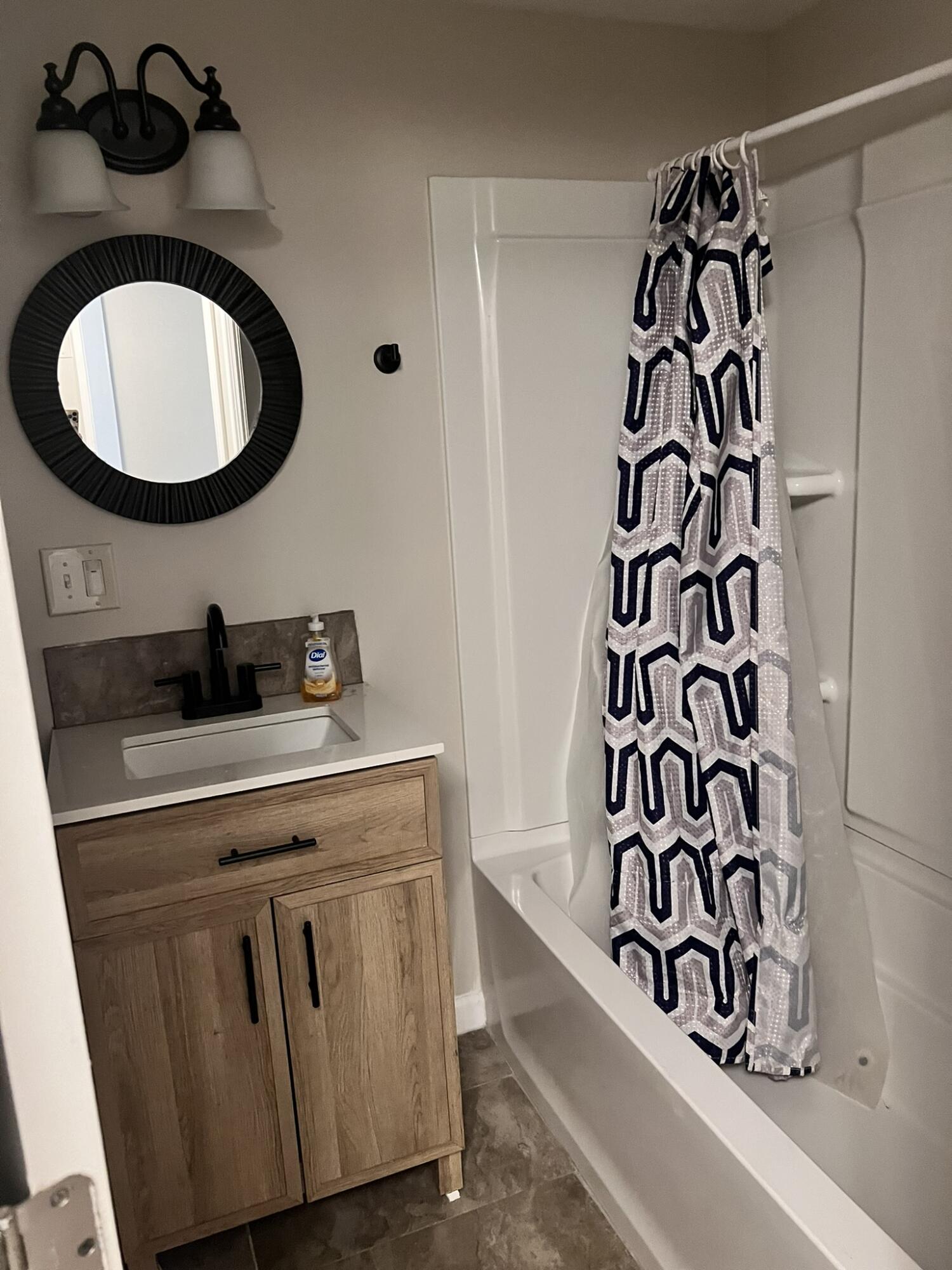 2361 Susan Drive Crestview, FL 32536 - Photo 10 of 12 a bathroom with a sink and a mirror