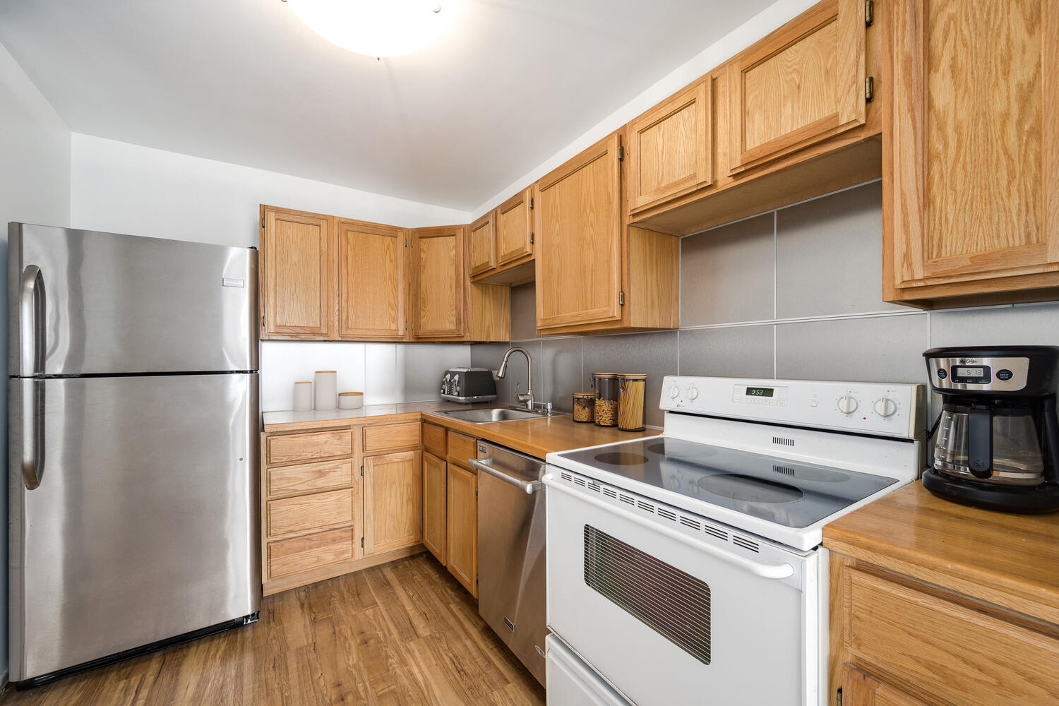 1030 North State Street, Unit 9G Chicago, IL 60610 - Photo 13 of 20 a kitchen with a white cabinets and white appliances