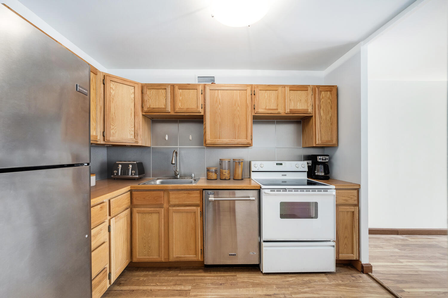 1030 North State Street, Unit 9G Chicago, IL 60610 - Photo 14 of 20 a kitchen with a stove top oven sink and cabinets