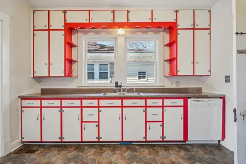 a view of a kitchen with storage and utility