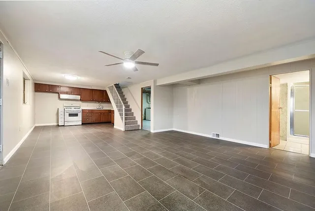 a view of a livingroom with a furniture and a ceiling fan