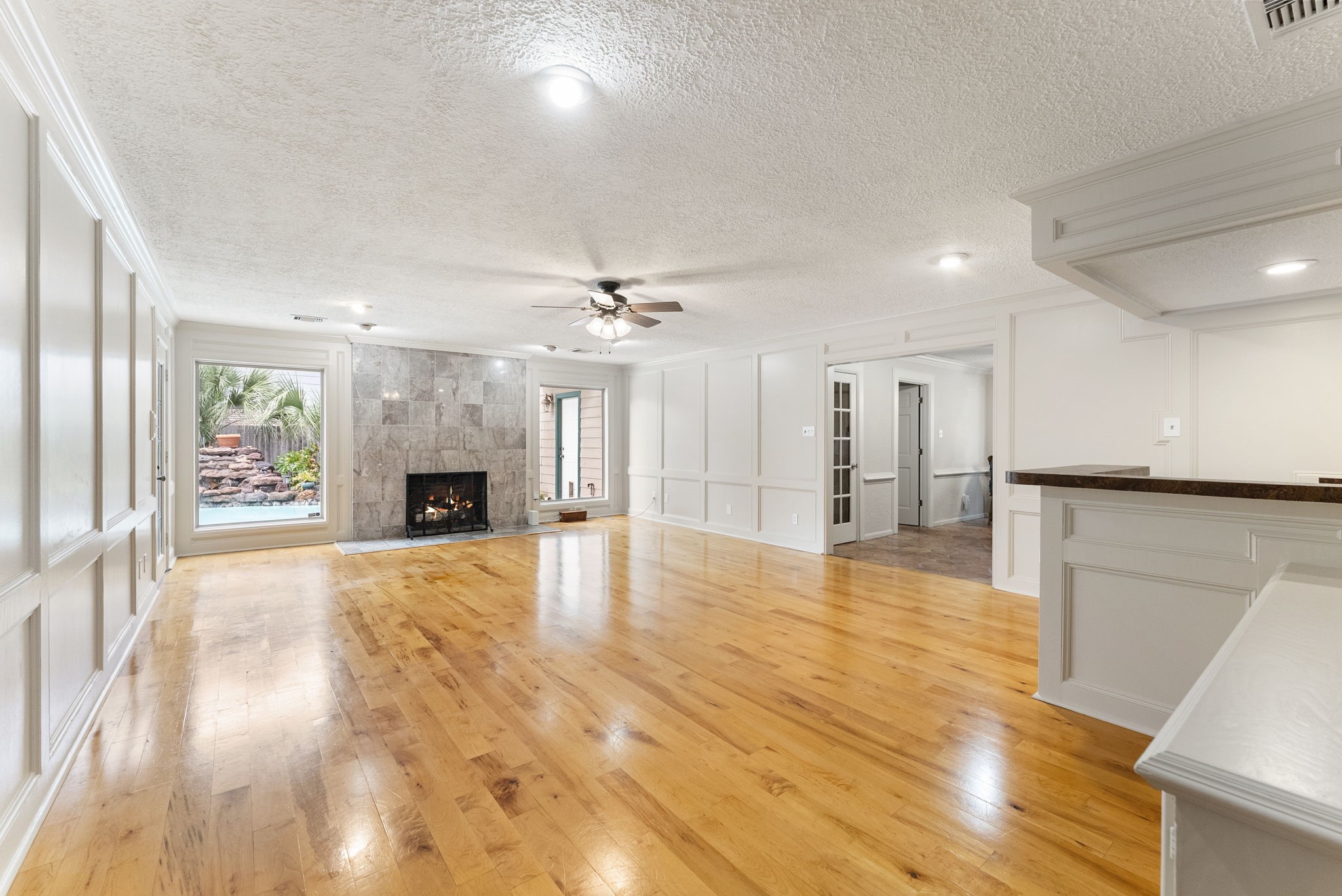 5718 Glenmere Lane Spring, TX 77379 - Photo 18 of 40 a view of an empty room with kitchen and a window