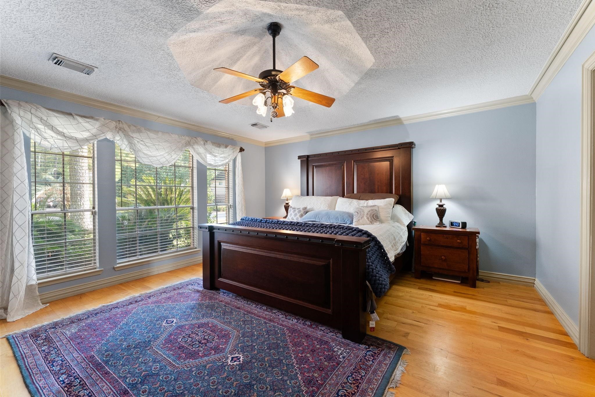 5718 Glenmere Lane Spring, TX 77379 - Photo 20 of 40 Welcome to your primary oasis! The
large windows bring an abundance
of light into the room.