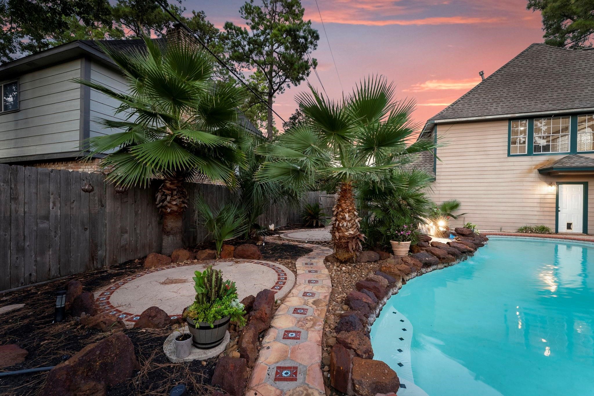 5718 Glenmere Lane Spring, TX 77379 - Photo 38 of 40 Professionally landscaped gardens
surround the pool area, enhancing
the outdoor ambiance.