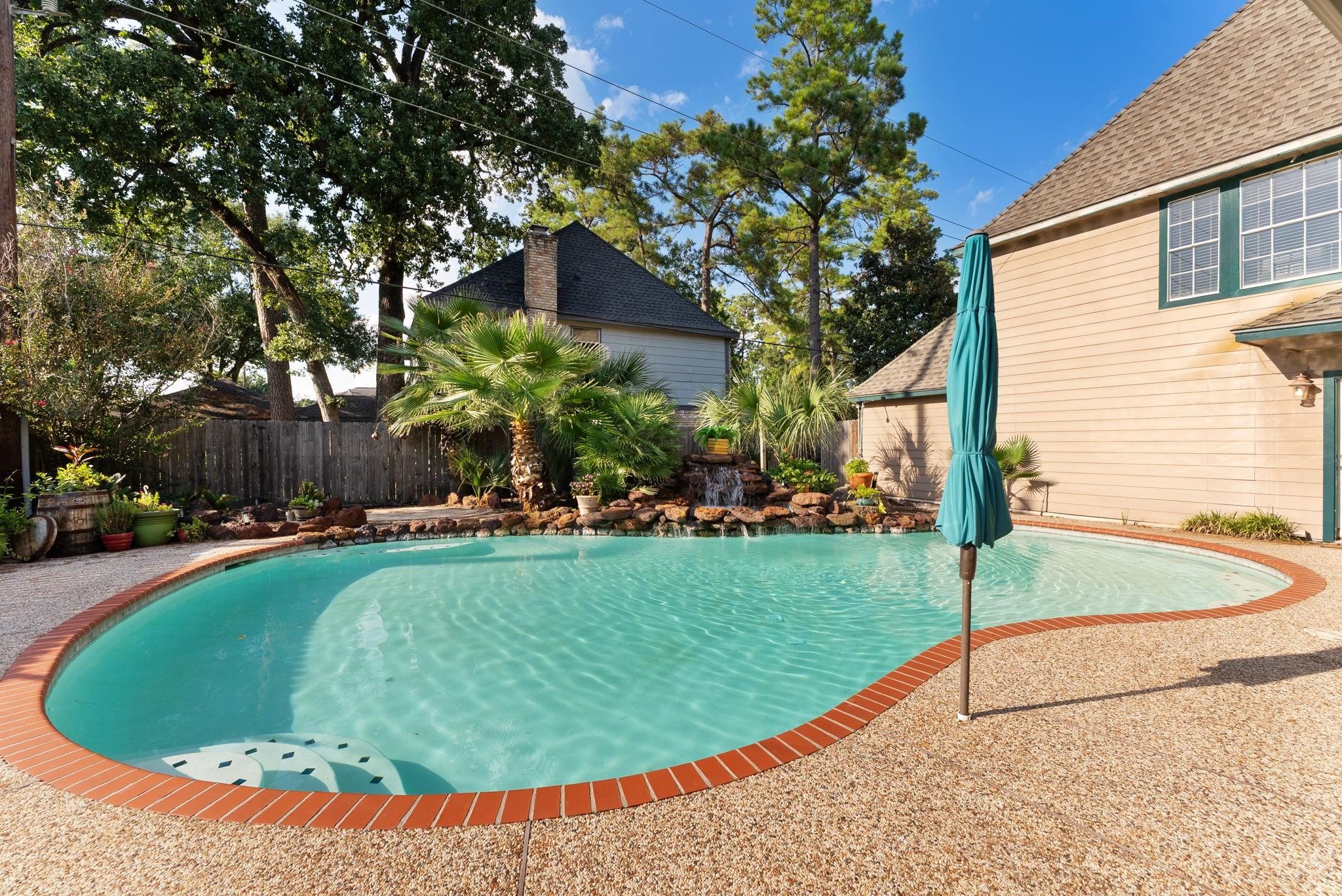 5718 Glenmere Lane Spring, TX 77379 - Photo 40 of 40 a view of a swimming pool with a patio
