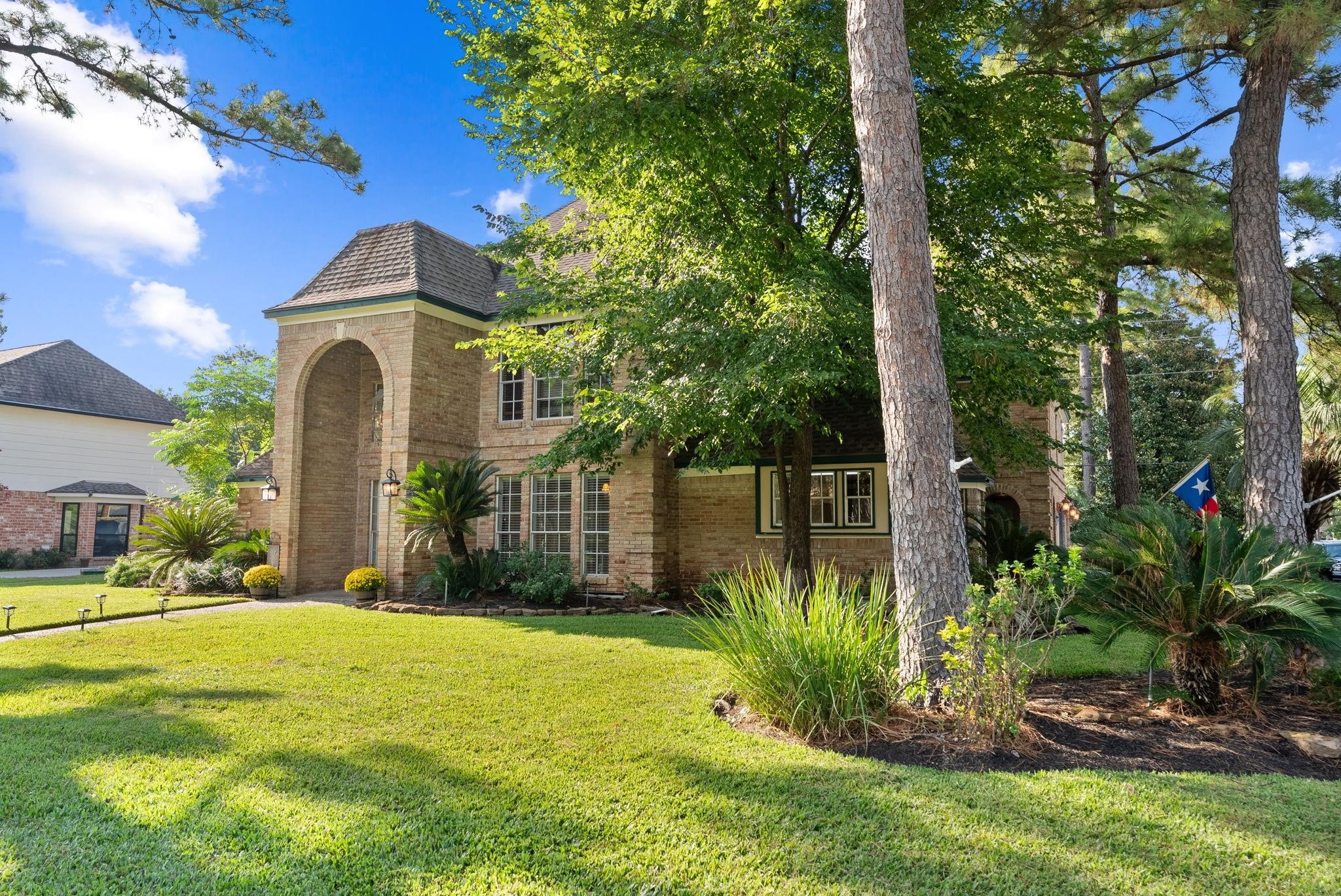 5718 Glenmere Lane Spring, TX 77379 - Photo 4 of 40 a front view of a house with a yard