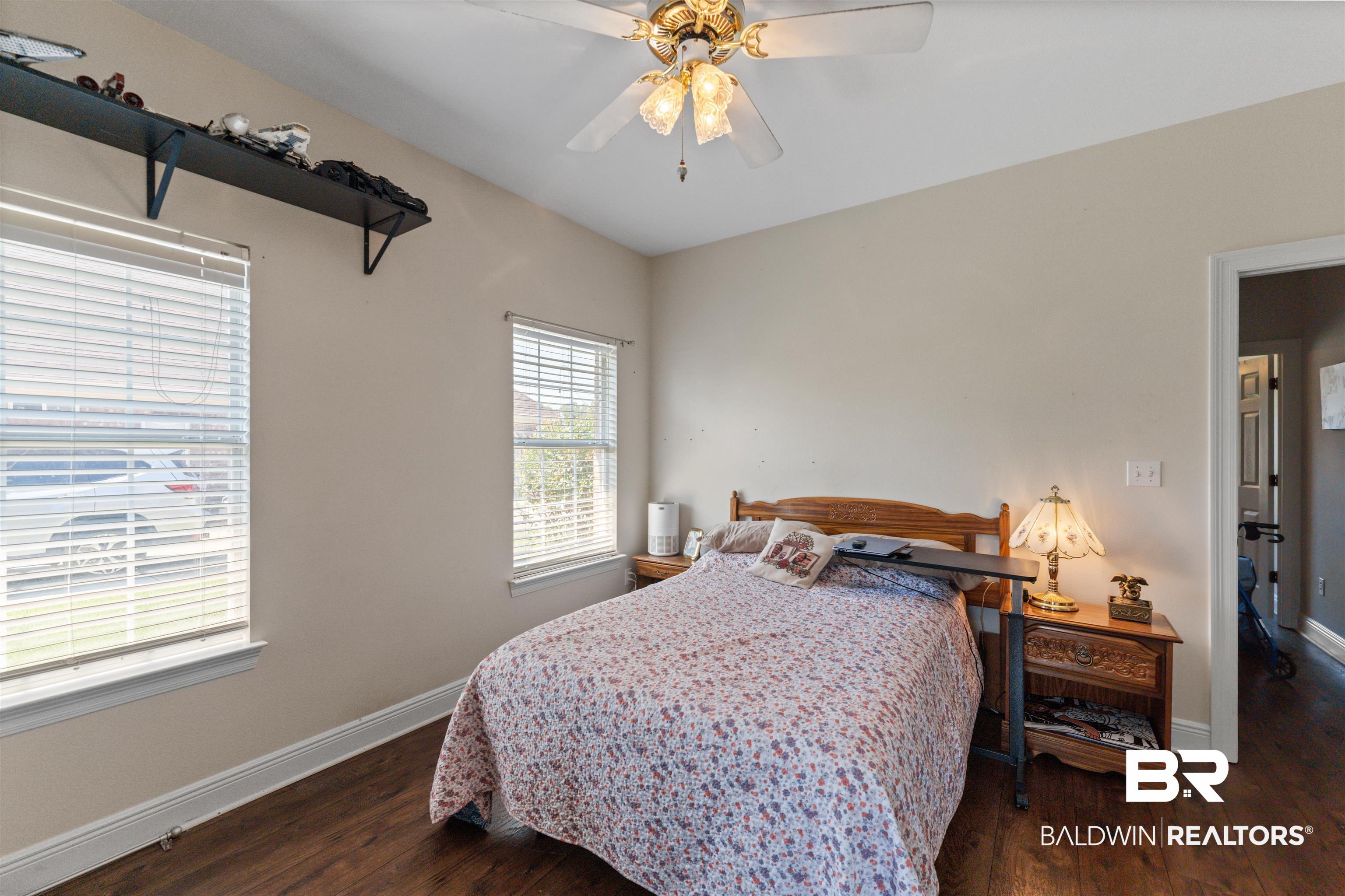 12664 Hunters Chase Foley, AL 36535 - Photo 41 of 62 Bedroom featuring dark wood-style flooring and a ceiling fan