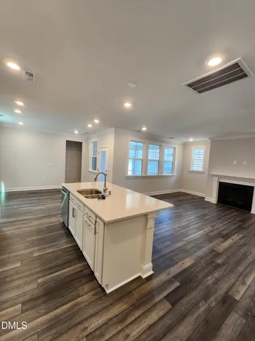 a kitchen with stainless steel appliances a stove microwave and cabinets