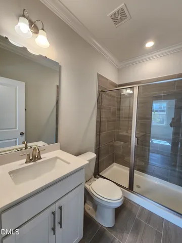 a view of wooden floor and windows in a room