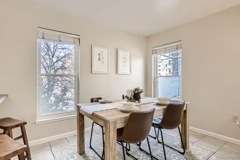 a kitchen with stainless steel appliances granite countertop a sink a stove and cabinets