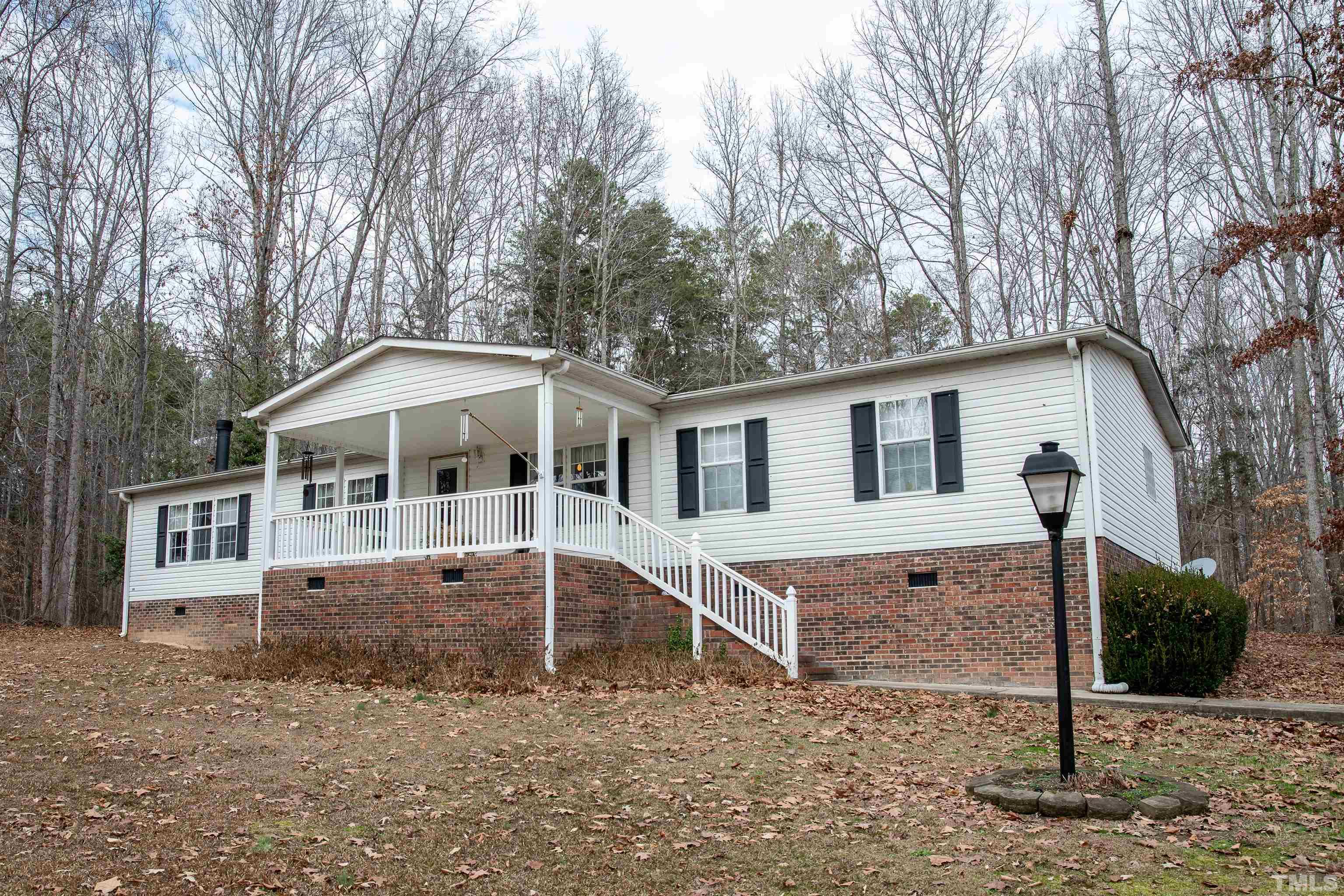 914 Stoney Mountain Road Rougemont, NC 27572 - Photo 1 of 19 a front view of a house with a yard