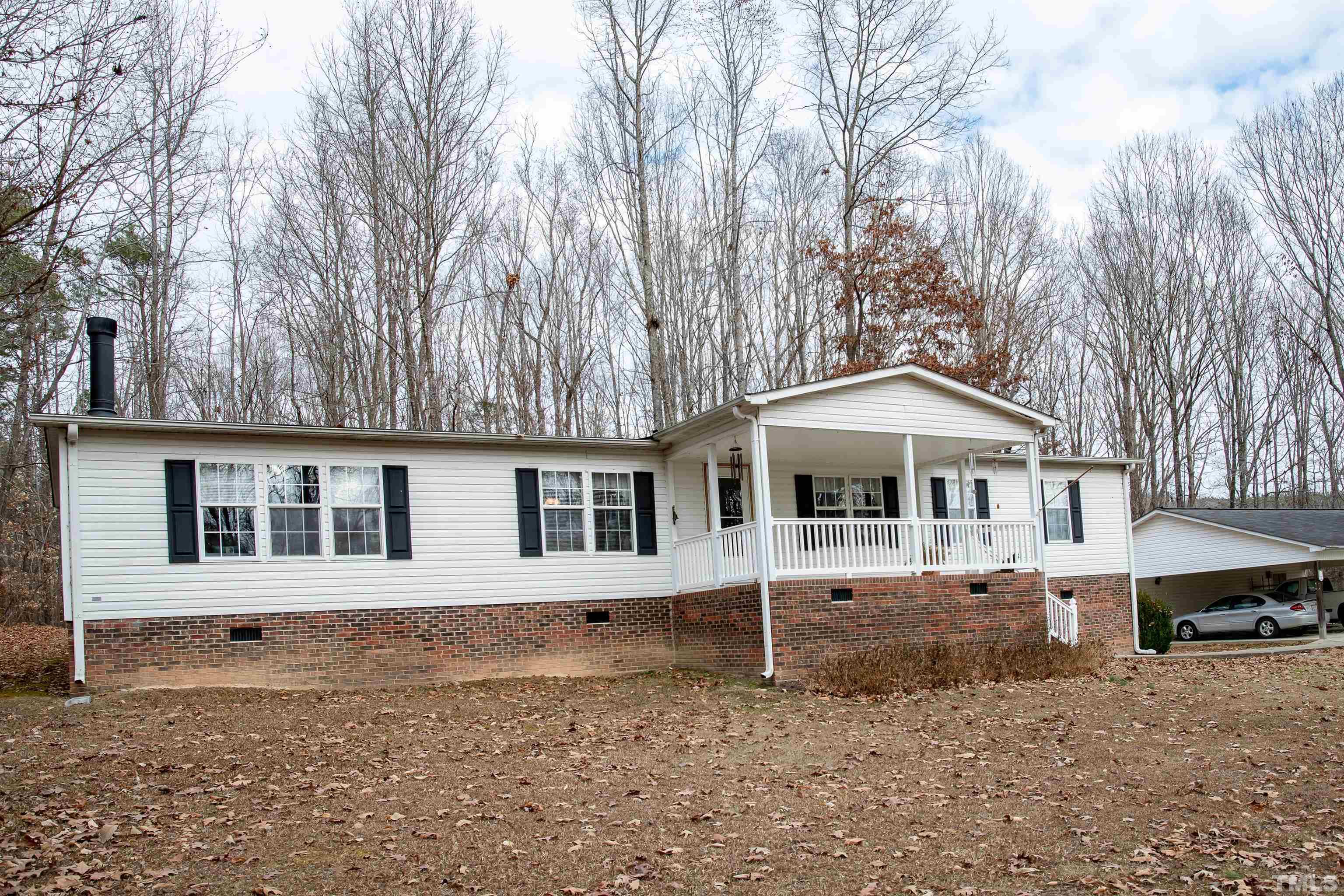 914 Stoney Mountain Road Rougemont, NC 27572 - Photo 2 of 19 a front view of a house with a yard