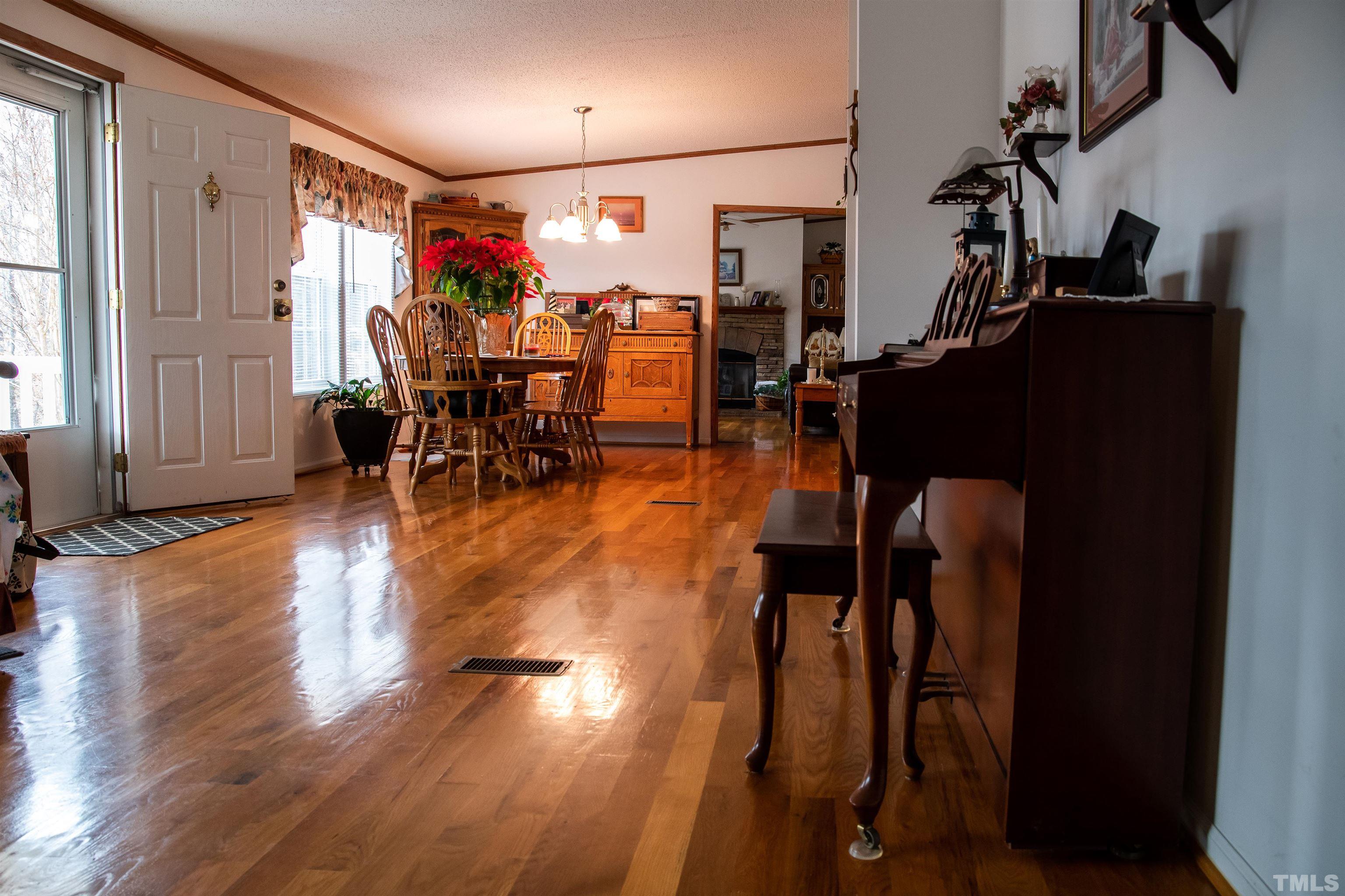914 Stoney Mountain Road Rougemont, NC 27572 - Photo 13 of 19 a living room with furniture and wooden floor