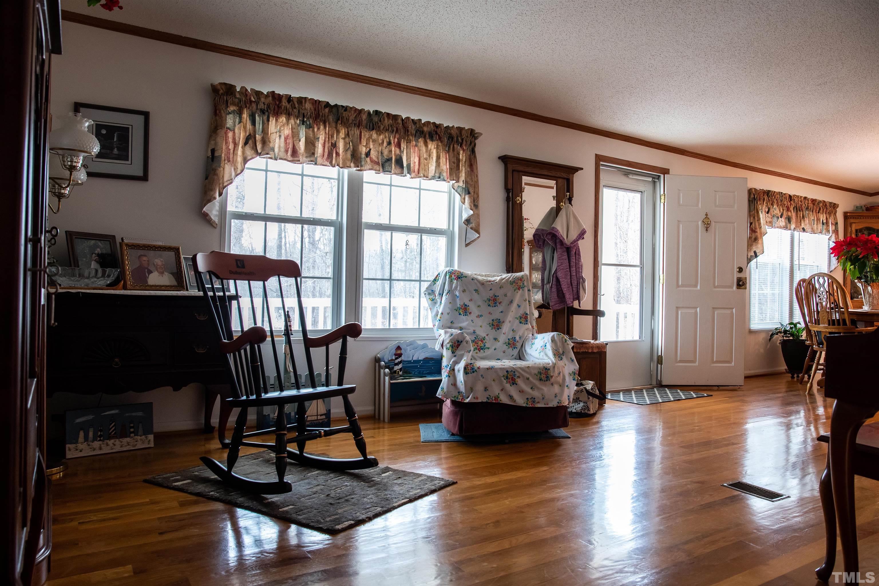 914 Stoney Mountain Road Rougemont, NC 27572 - Photo 17 of 19 a living room with furniture and a large window