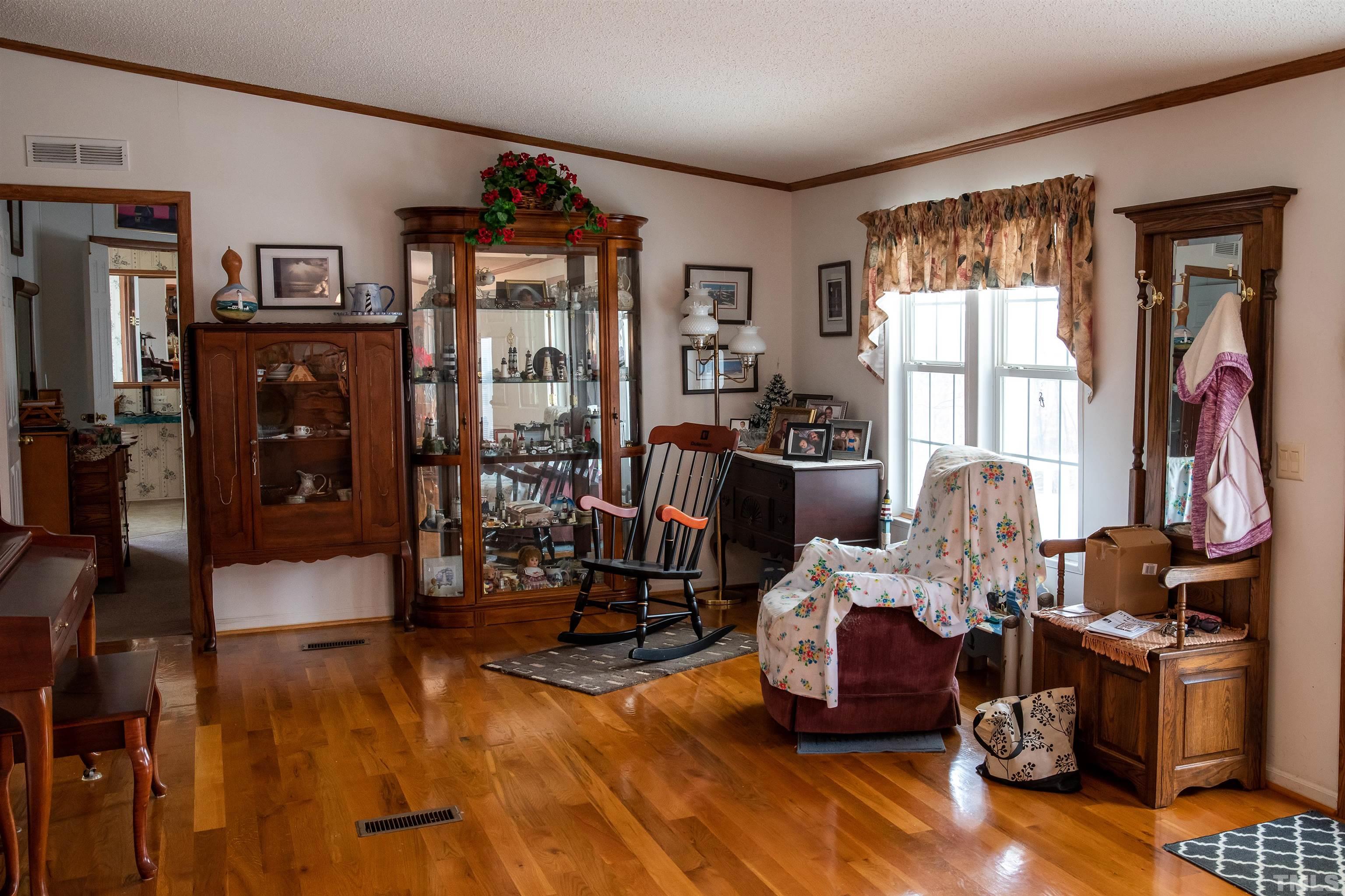 914 Stoney Mountain Road Rougemont, NC 27572 - Photo 18 of 19 a living room with furniture and a flat screen tv